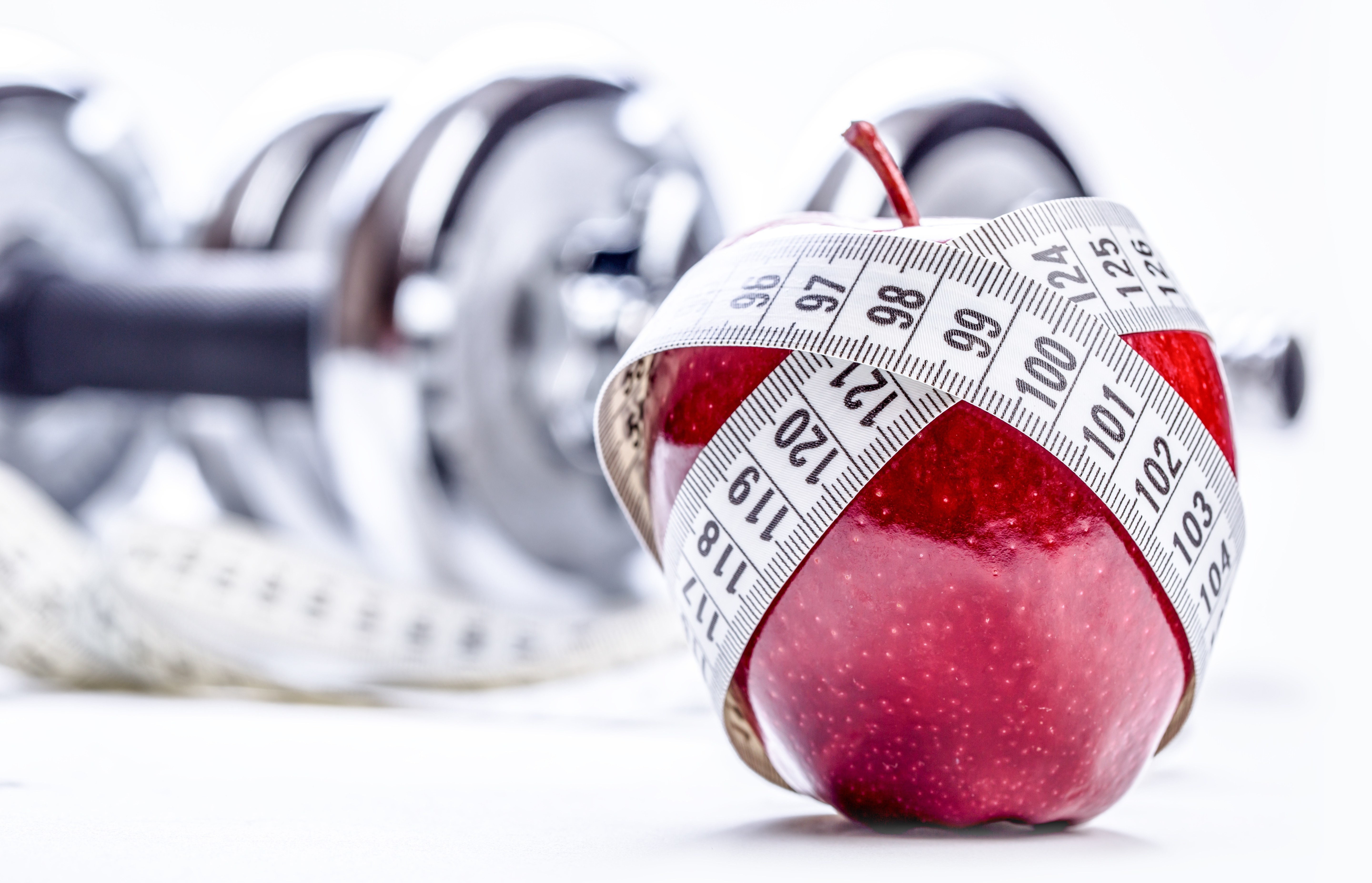 Apple with measuring tape and dumbbells HD Wallpaper