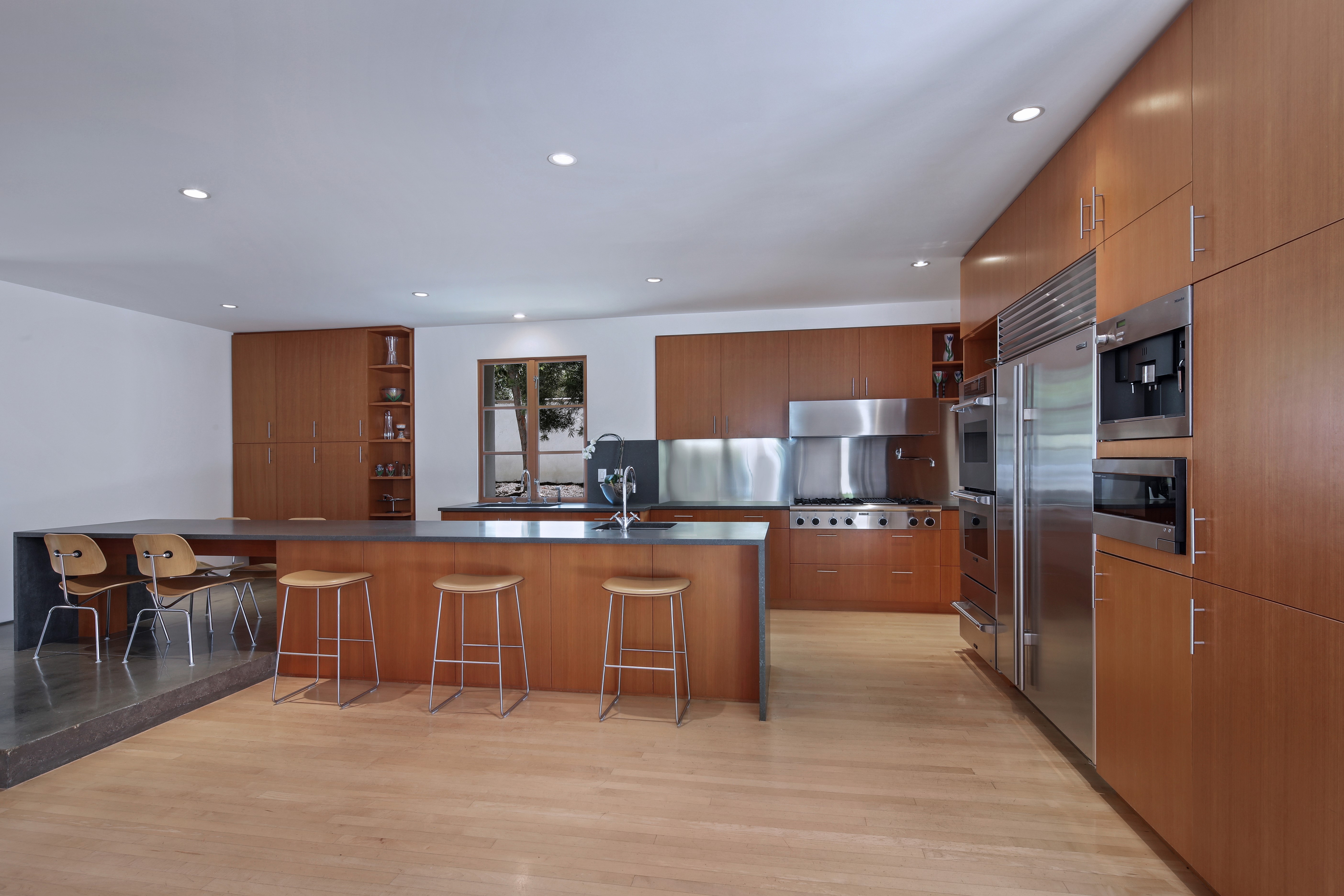 Modern Kitchen with Island and Stainless Steel Appliances HD Wallpaper
