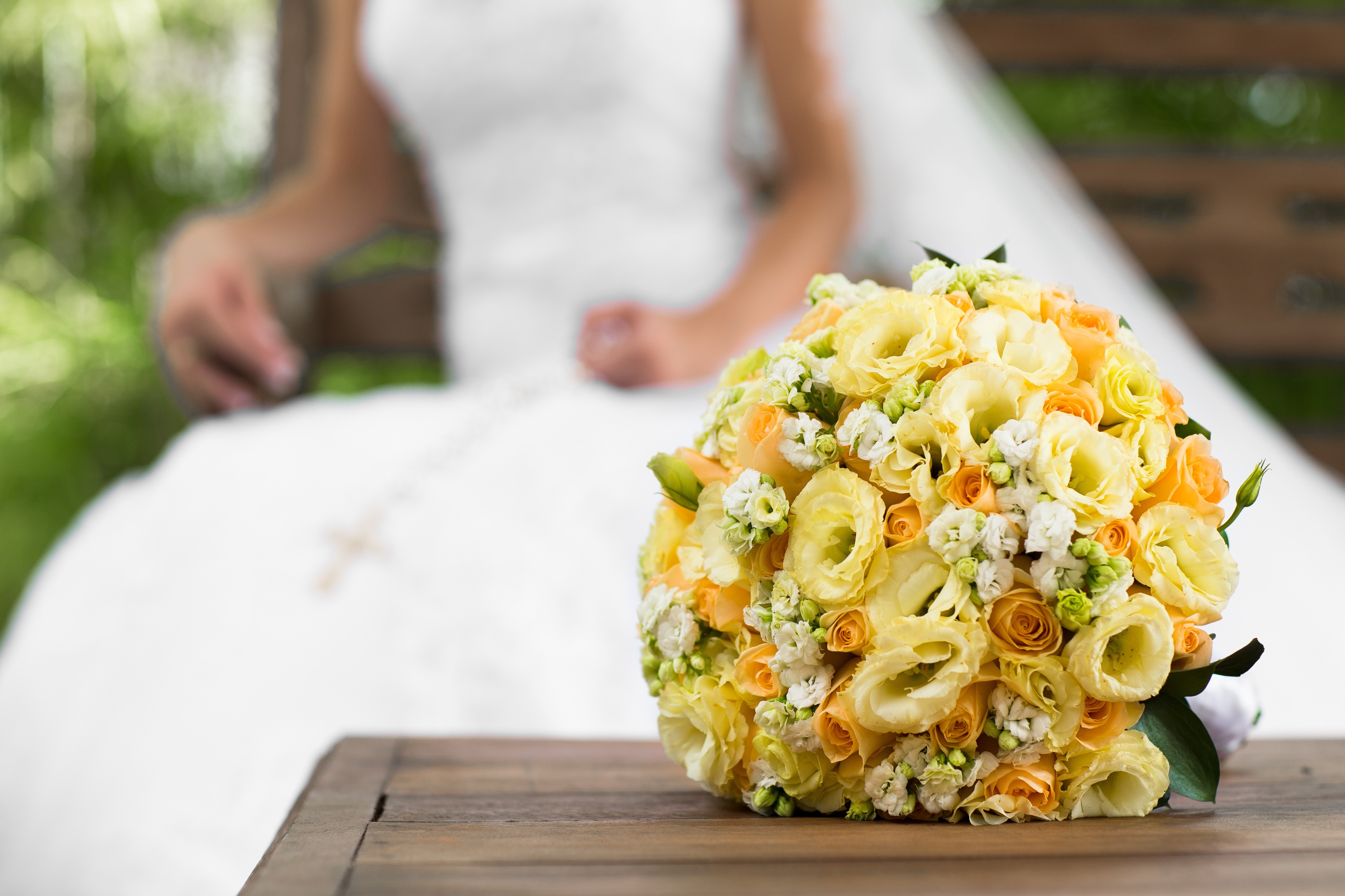Yellow Wedding Bouquet with Bride in Background HD Wallpaper