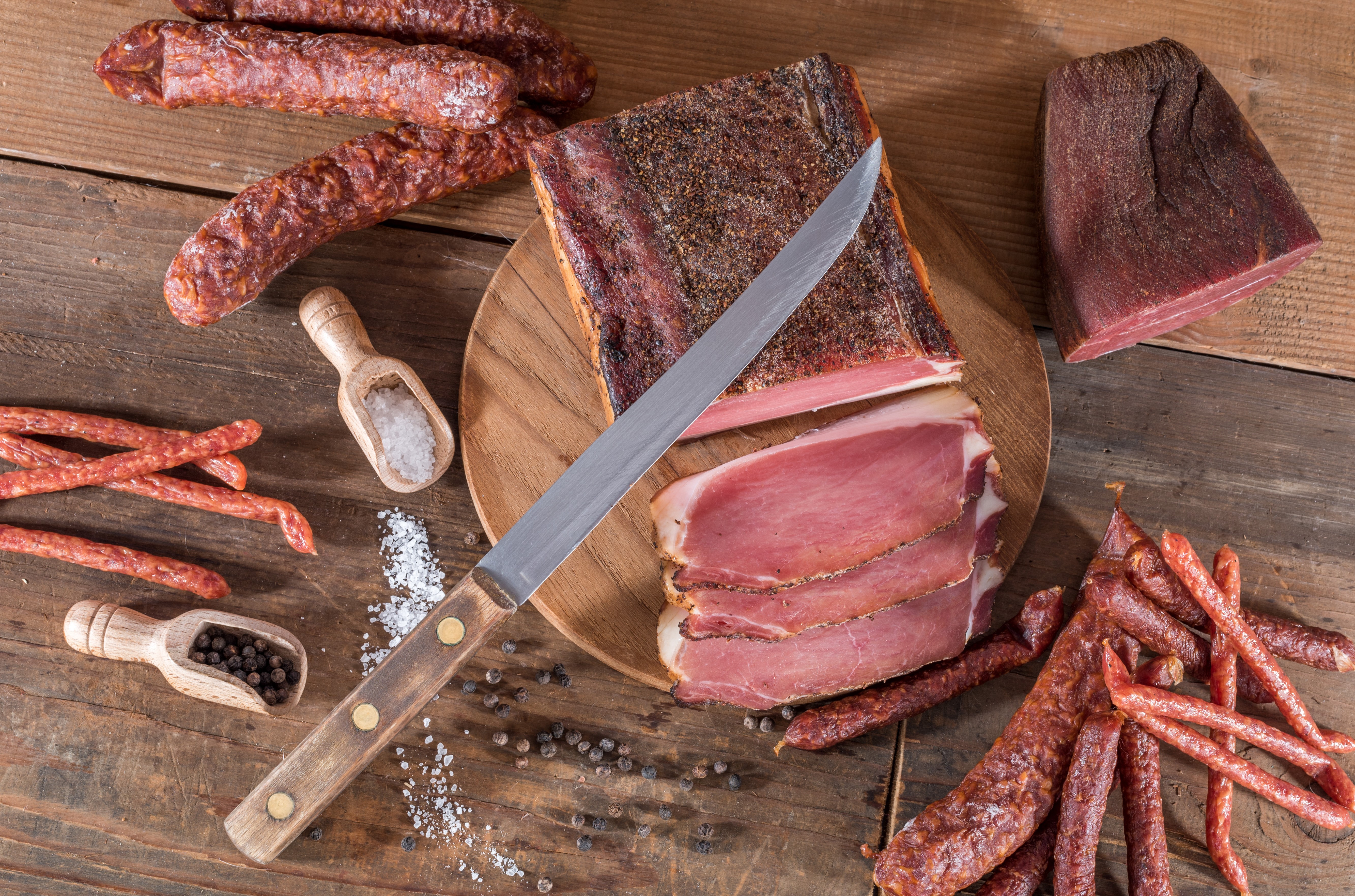 Meat products with knife, salt, and pepper HD Wallpaper