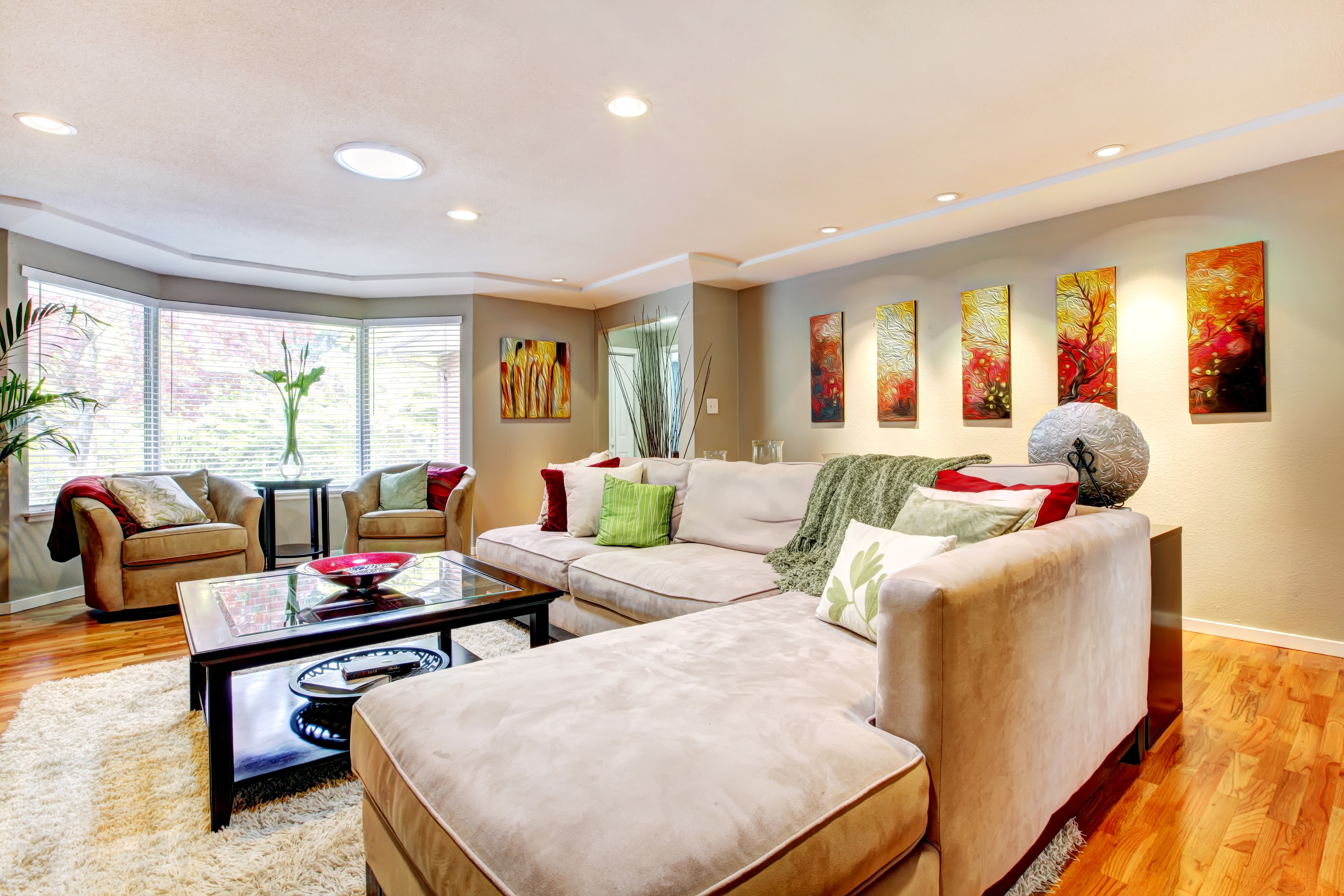 Living room with sectional sofa and bay window HD Wallpaper
