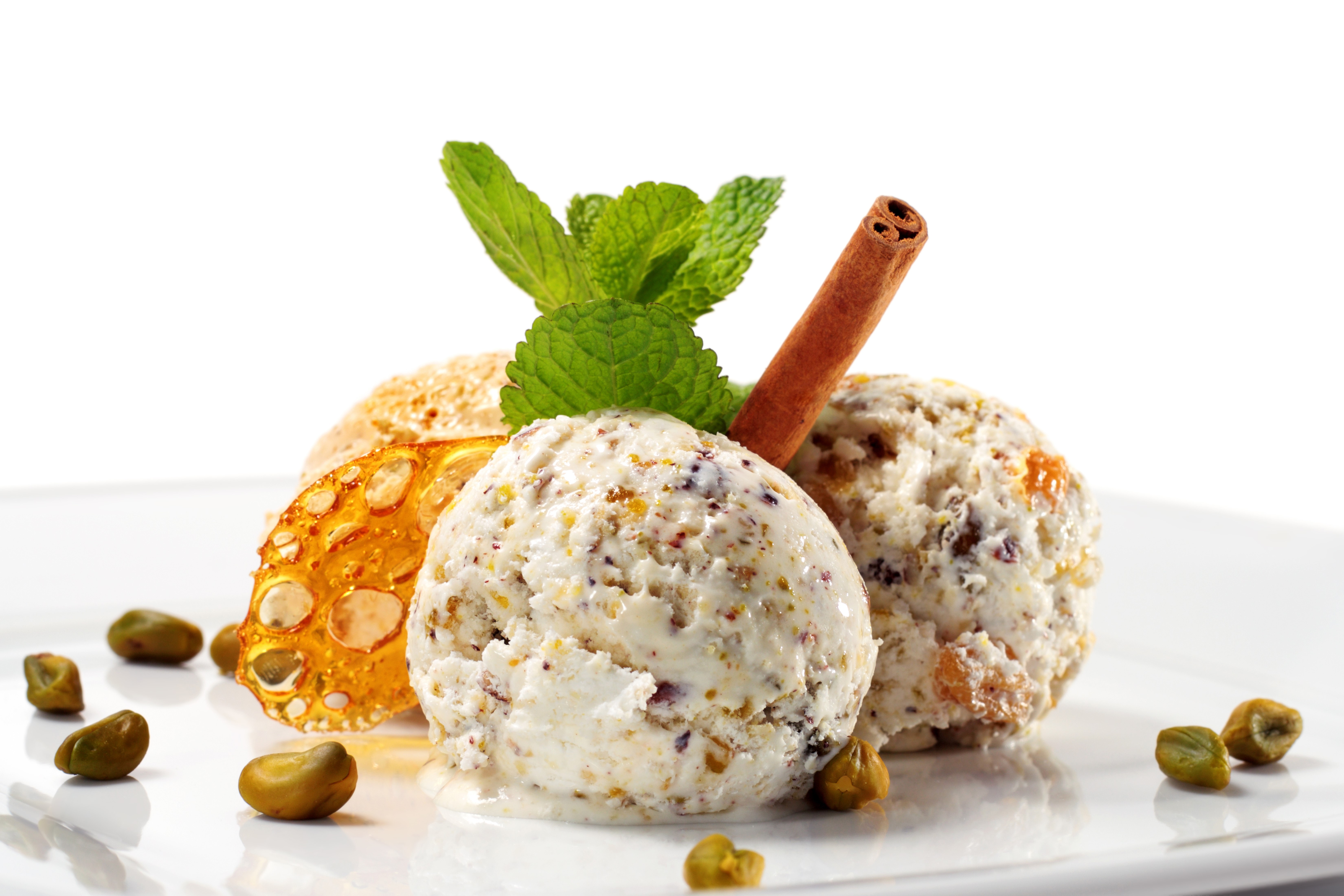 Ice cream scoops with pistachios, mint, and cinnamon HD Wallpaper