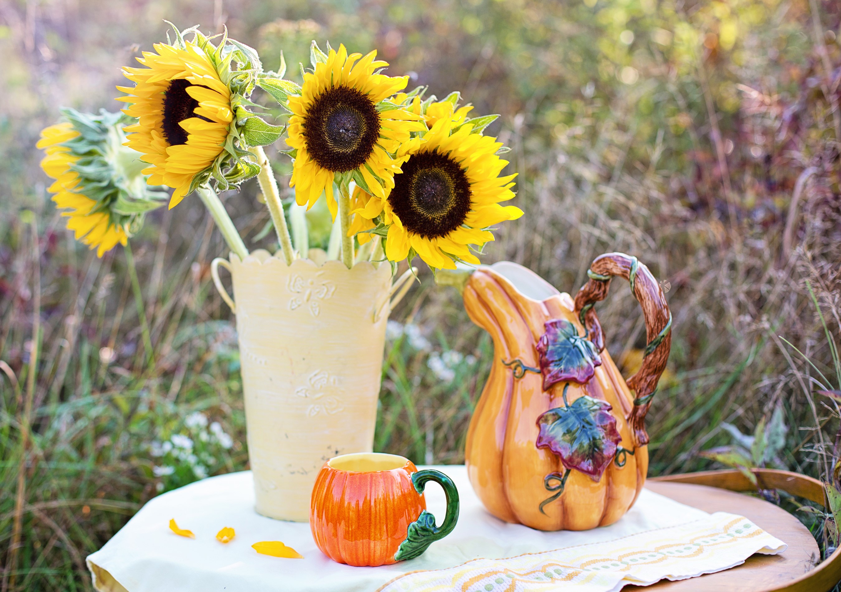 Sunflowers in a vase with a pumpkin jug and mug HD Wallpaper