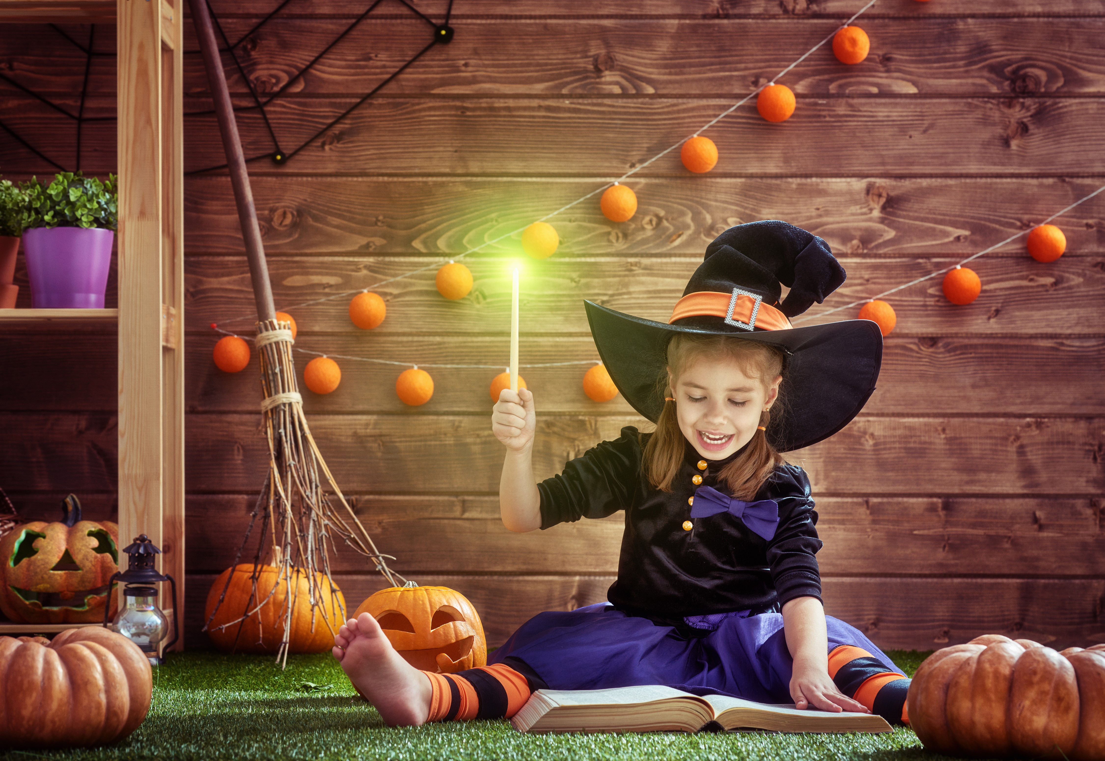 Girl in Witch Costume with Magic Wand and Book HD Wallpaper