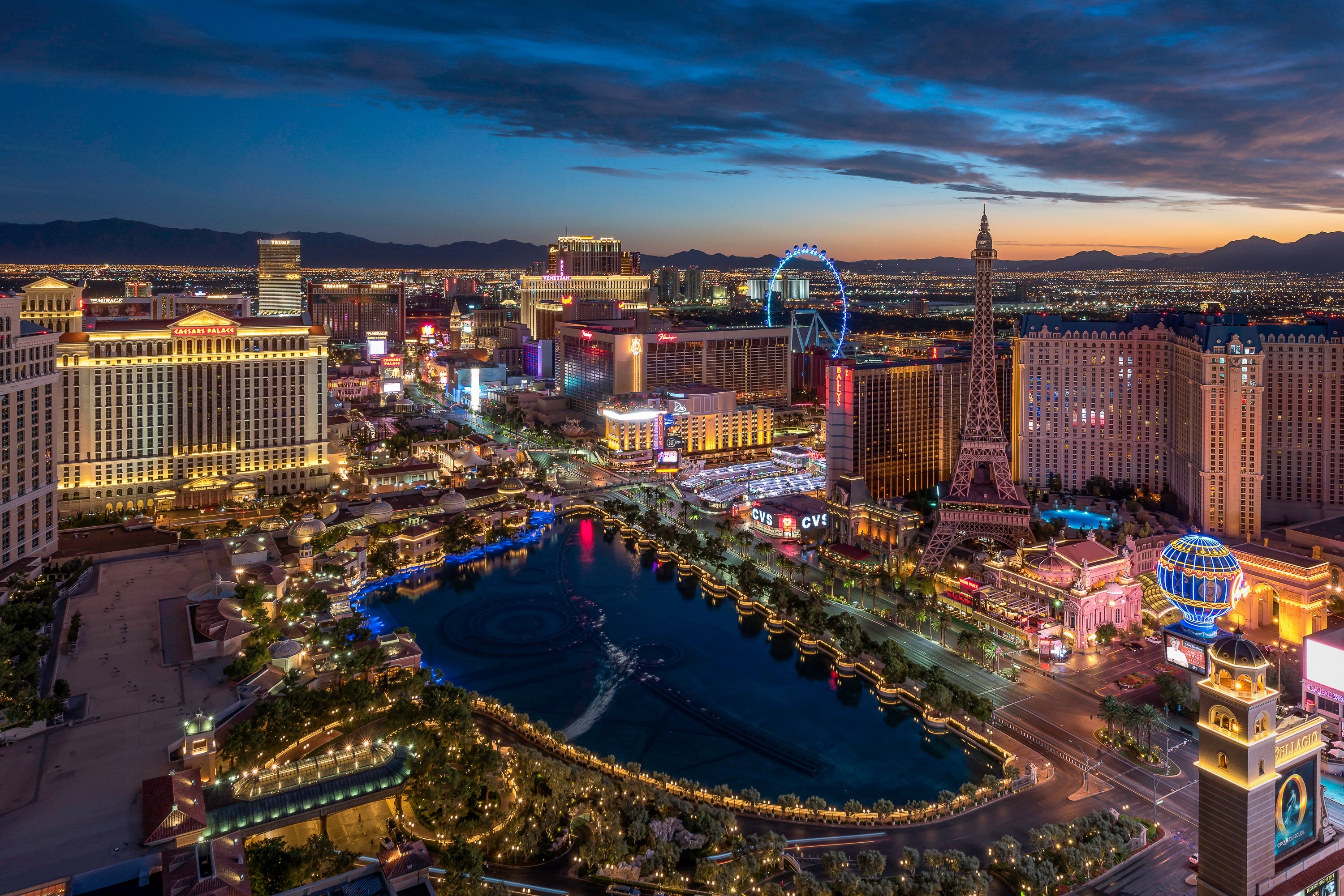 Las Vegas Strip at dusk with Bellagio fountains HD Wallpaper
