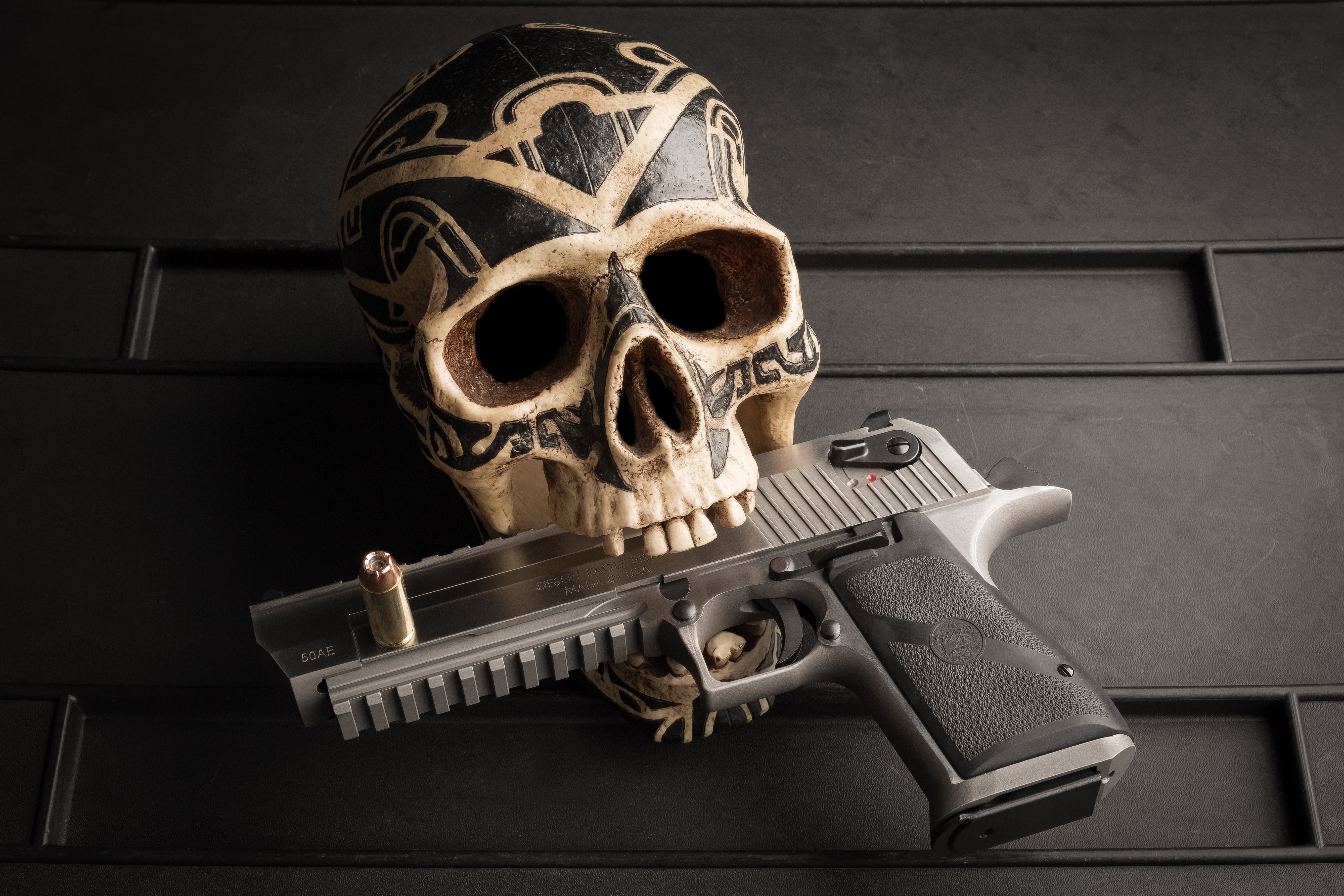 Skull with a pistol and bullet HD Wallpaper