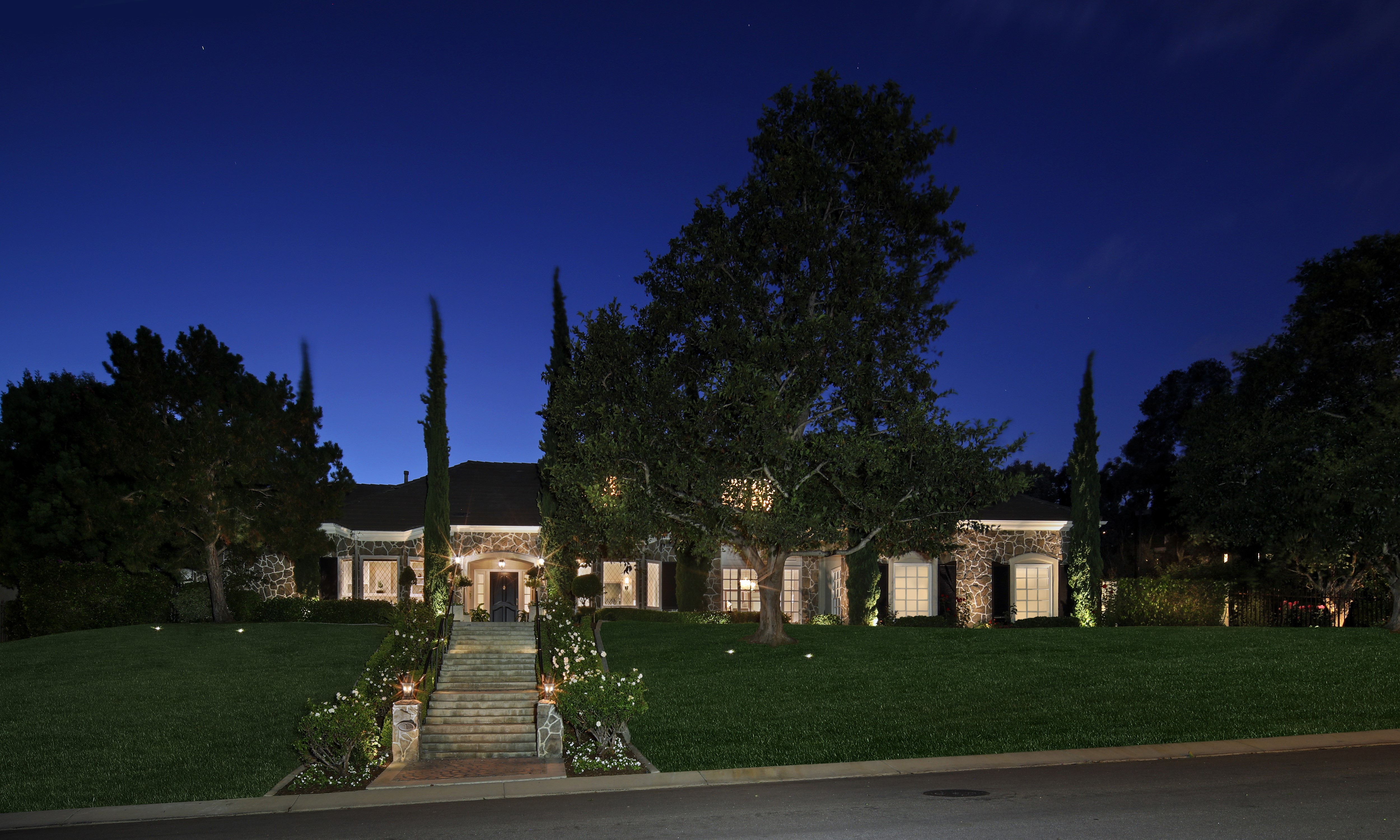 Stone Mansion with Stairs and Lawn at Night HD Wallpaper
