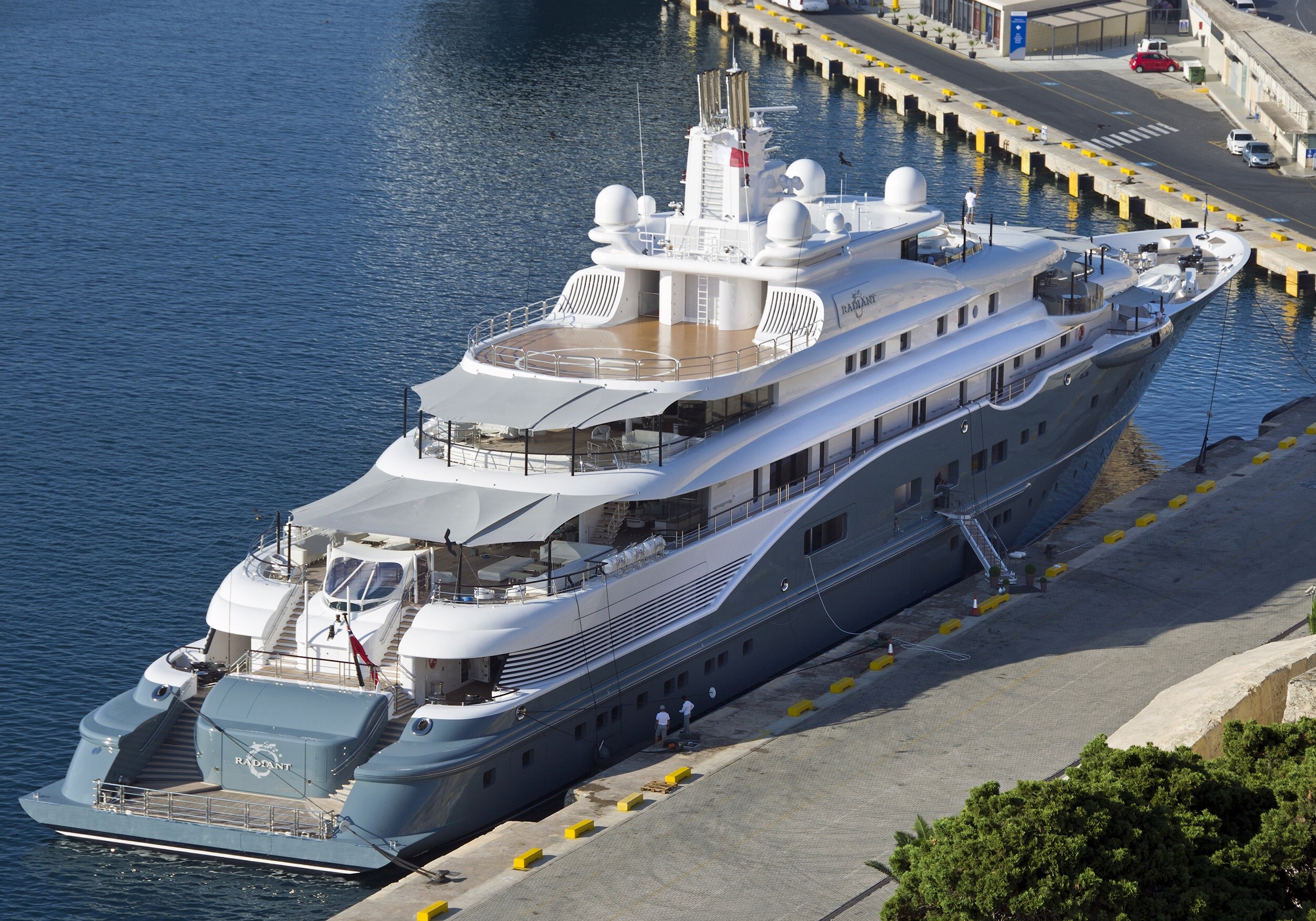 The luxury yacht Radiant docked at a harbor HD Wallpaper