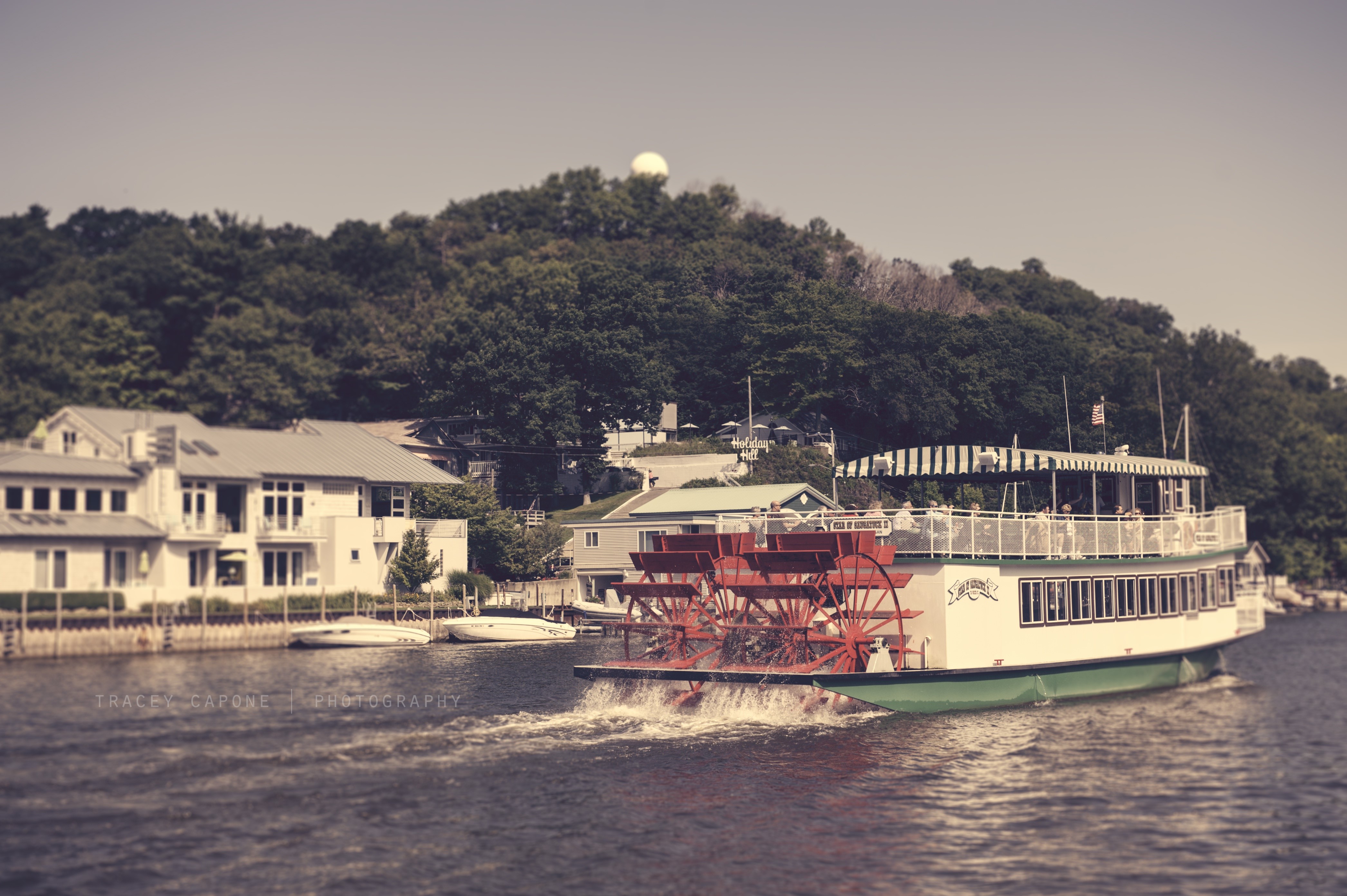 Riverboat on a lake with houses and trees HD Wallpaper