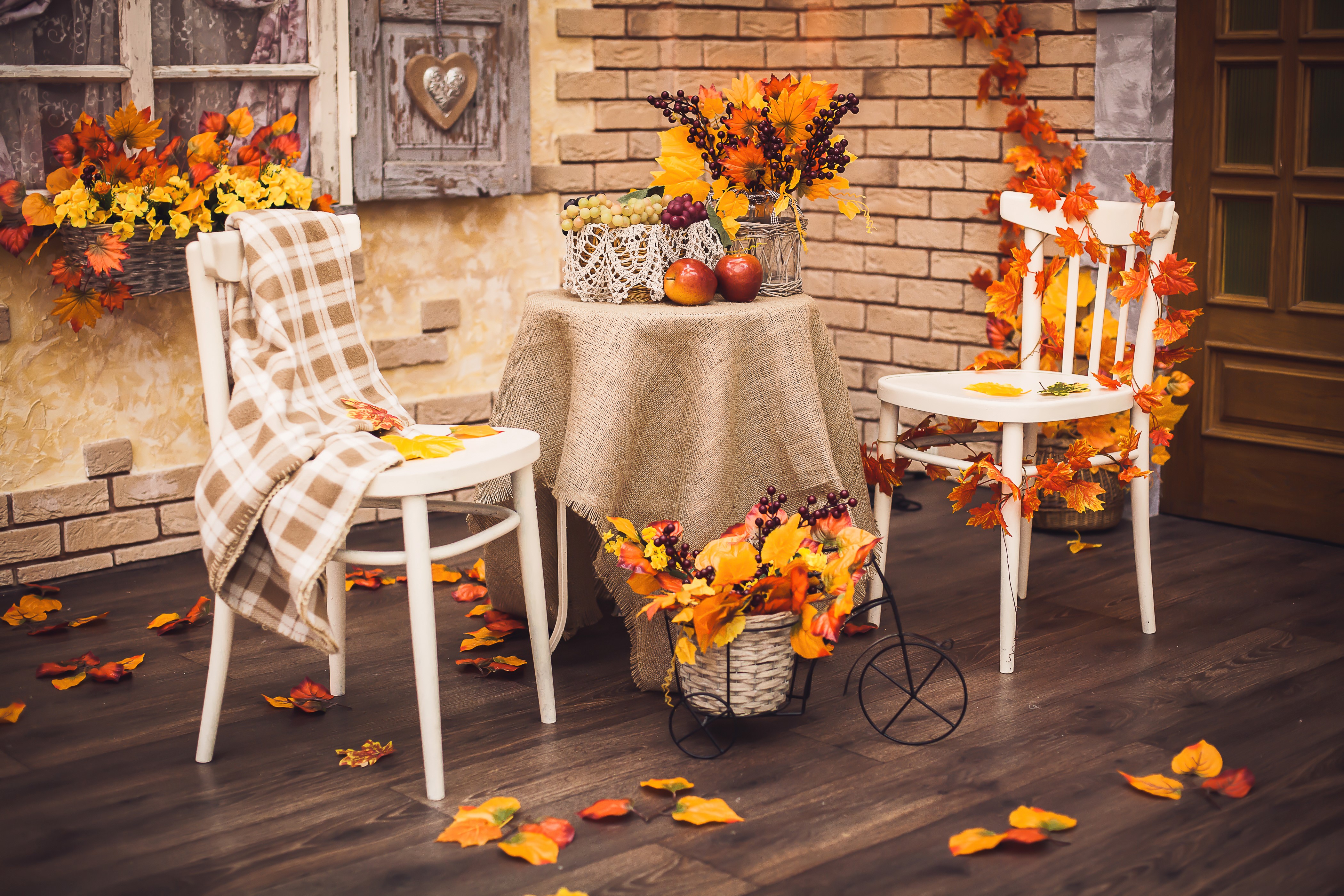 Autumn Table Setting with Chairs and Foliage HD Wallpaper