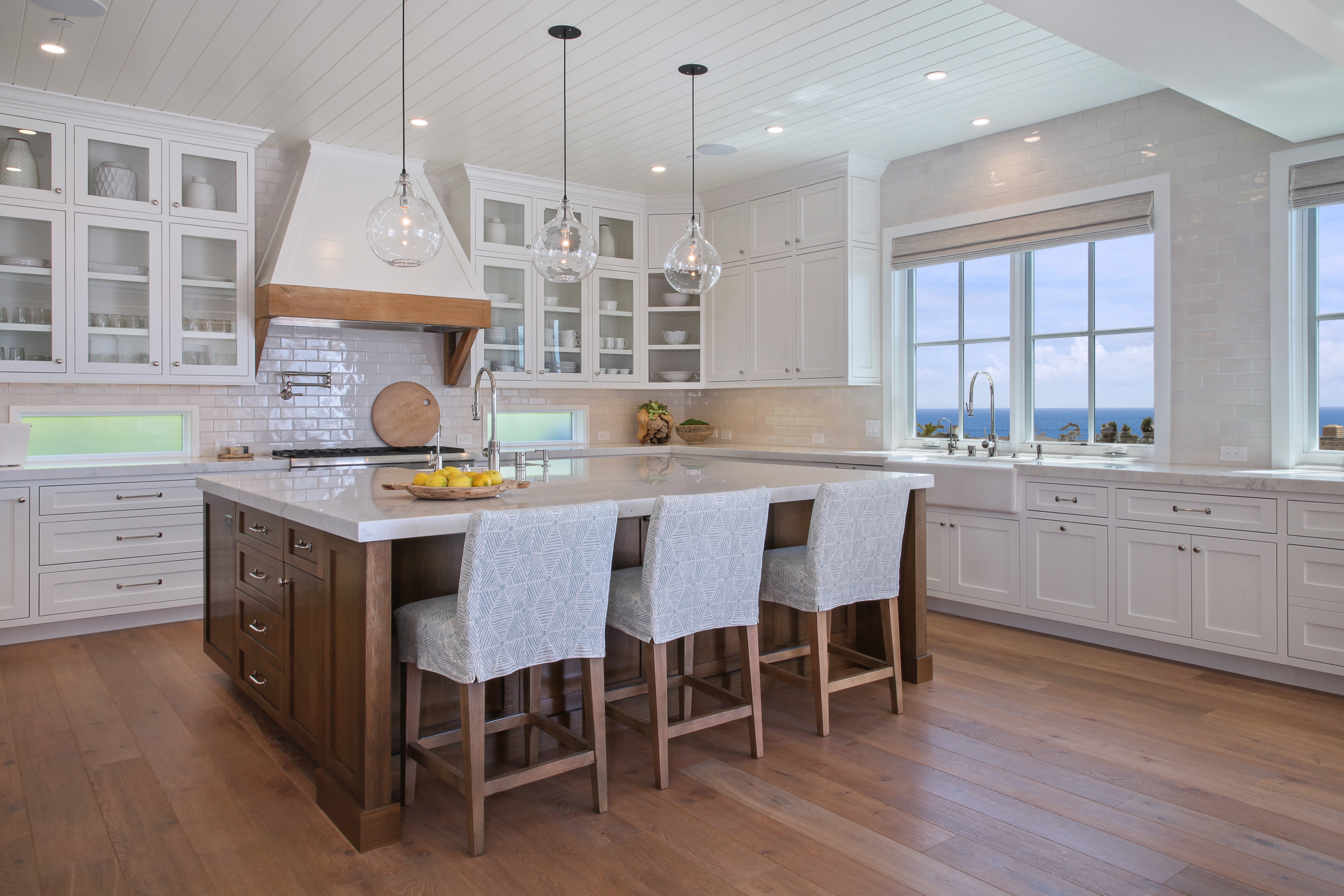 Kitchen with island and ocean view HD Wallpaper