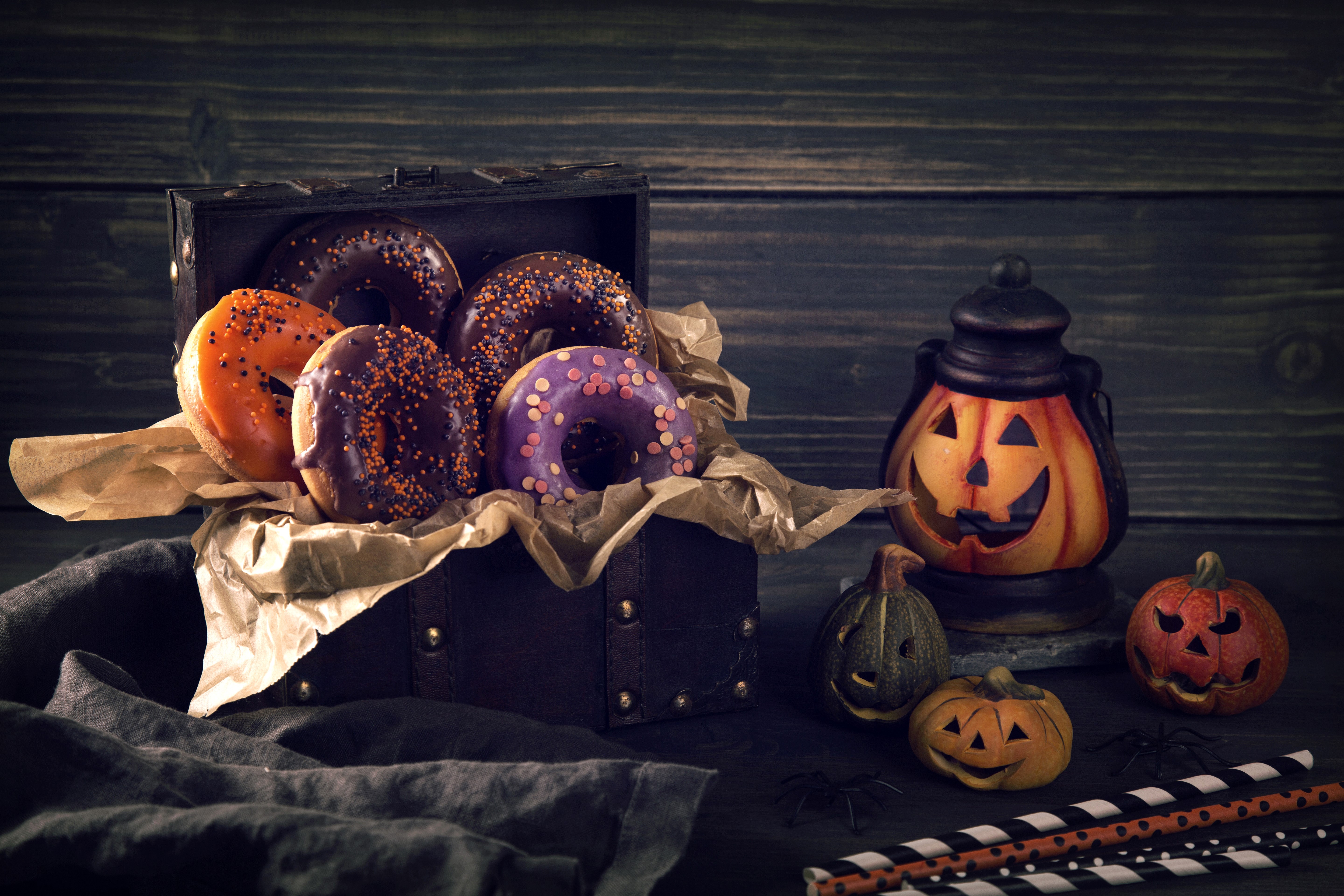 Halloween donuts in a chest with pumpkins and a lantern HD Wallpaper