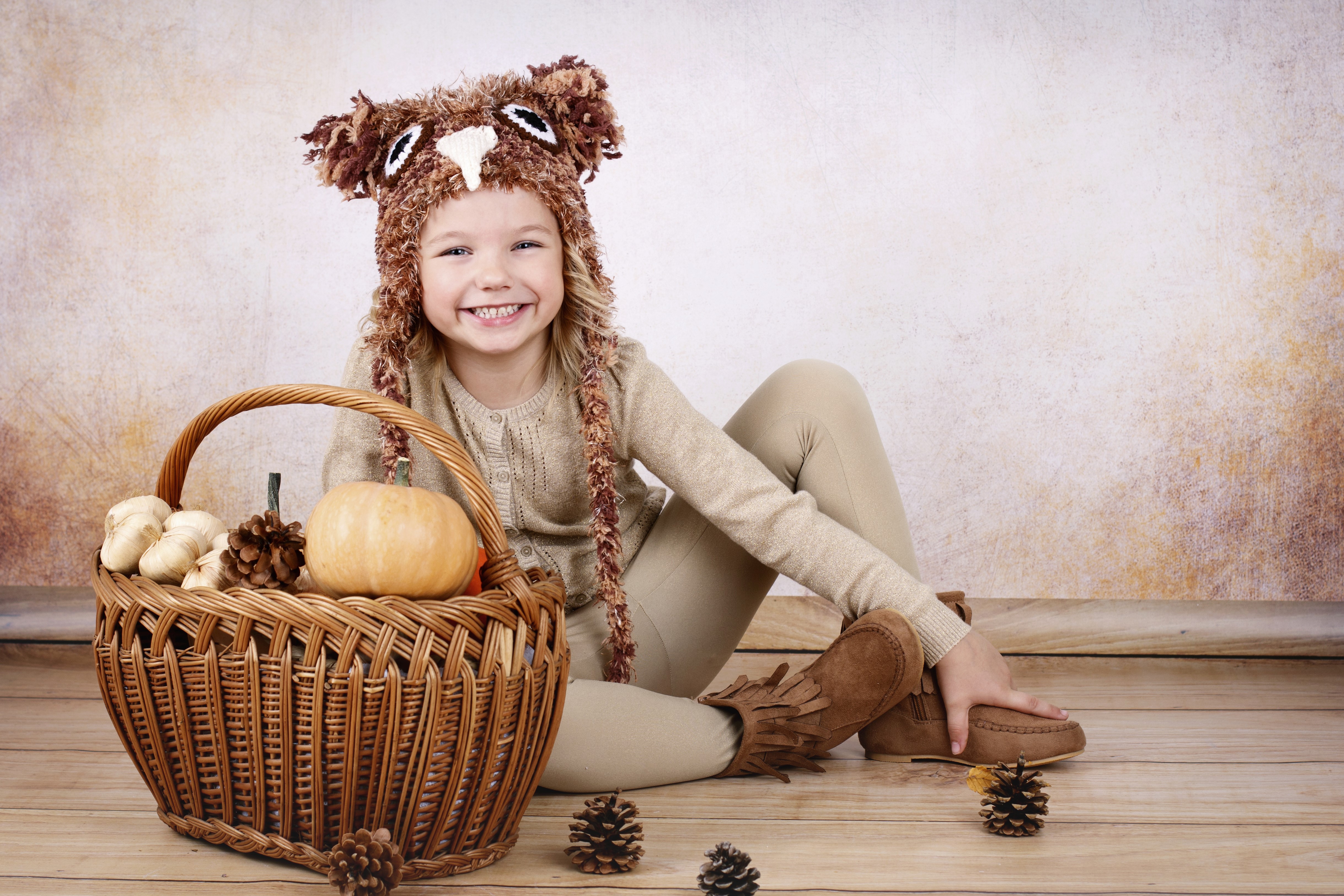 Girl in Owl Hat with Pumpkin and Pine Cones HD Wallpaper