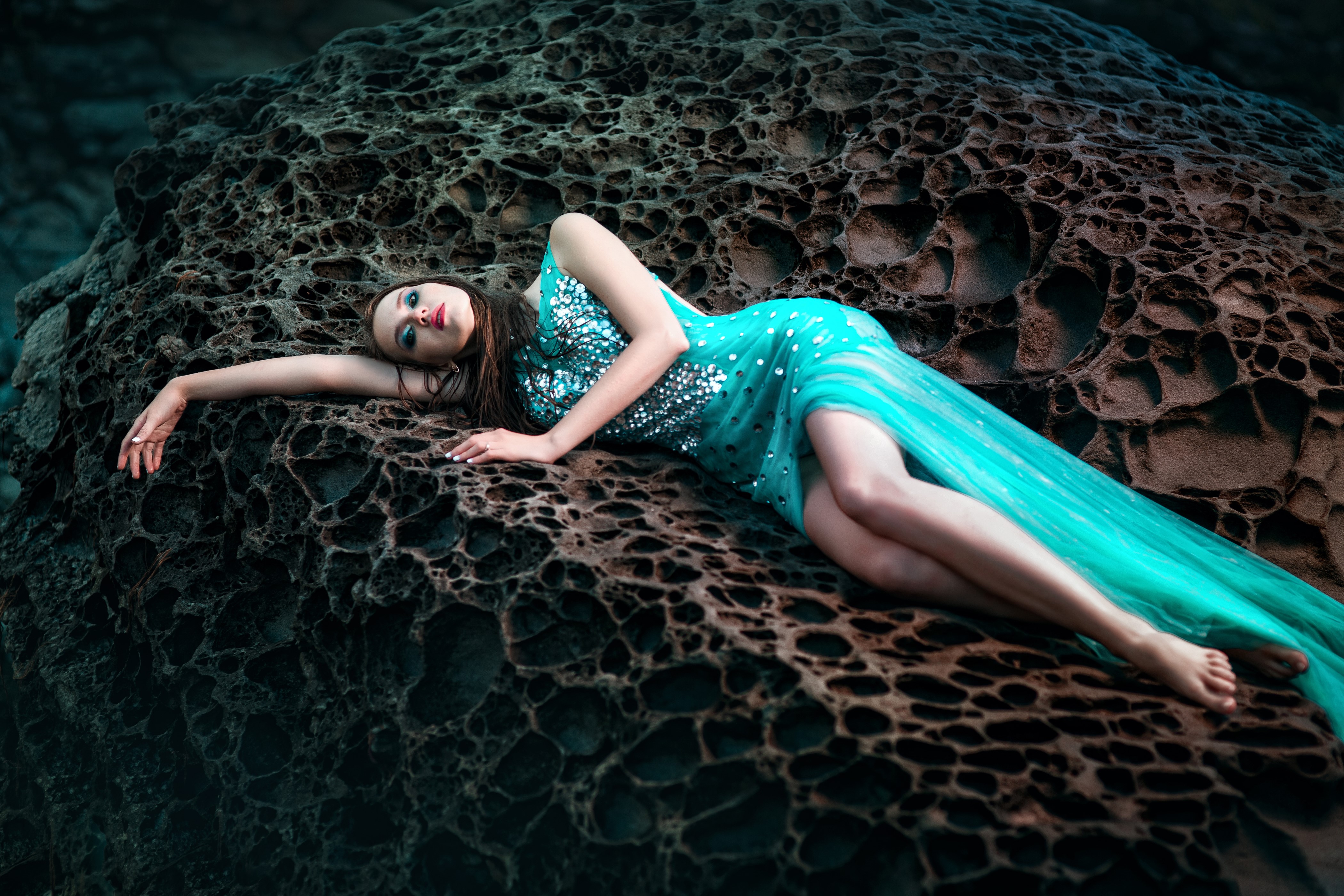 Woman in a blue dress on a rock HD Wallpaper