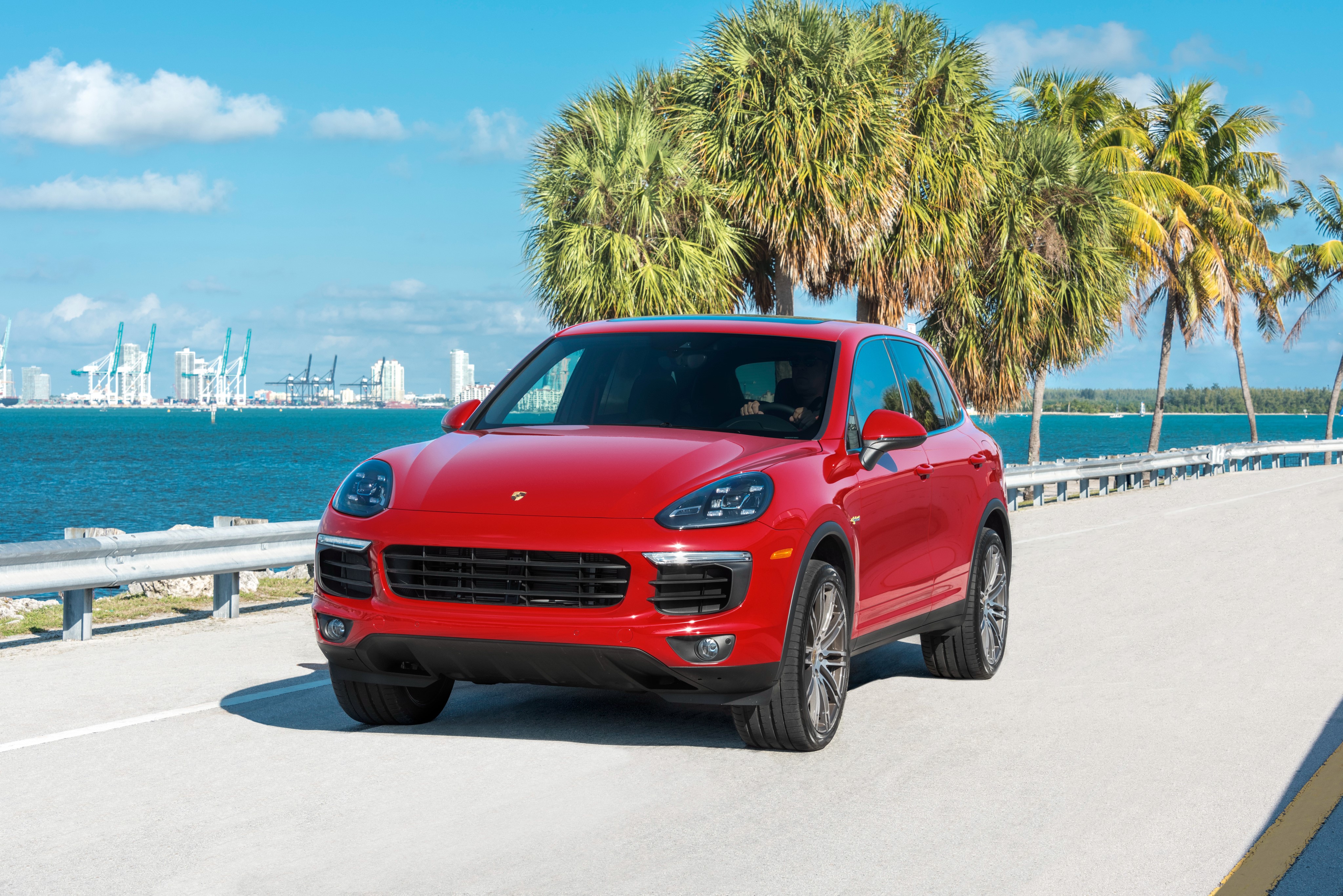 Red Porsche Cayenne S E-Hybrid on a Coastal Road HD Wallpaper