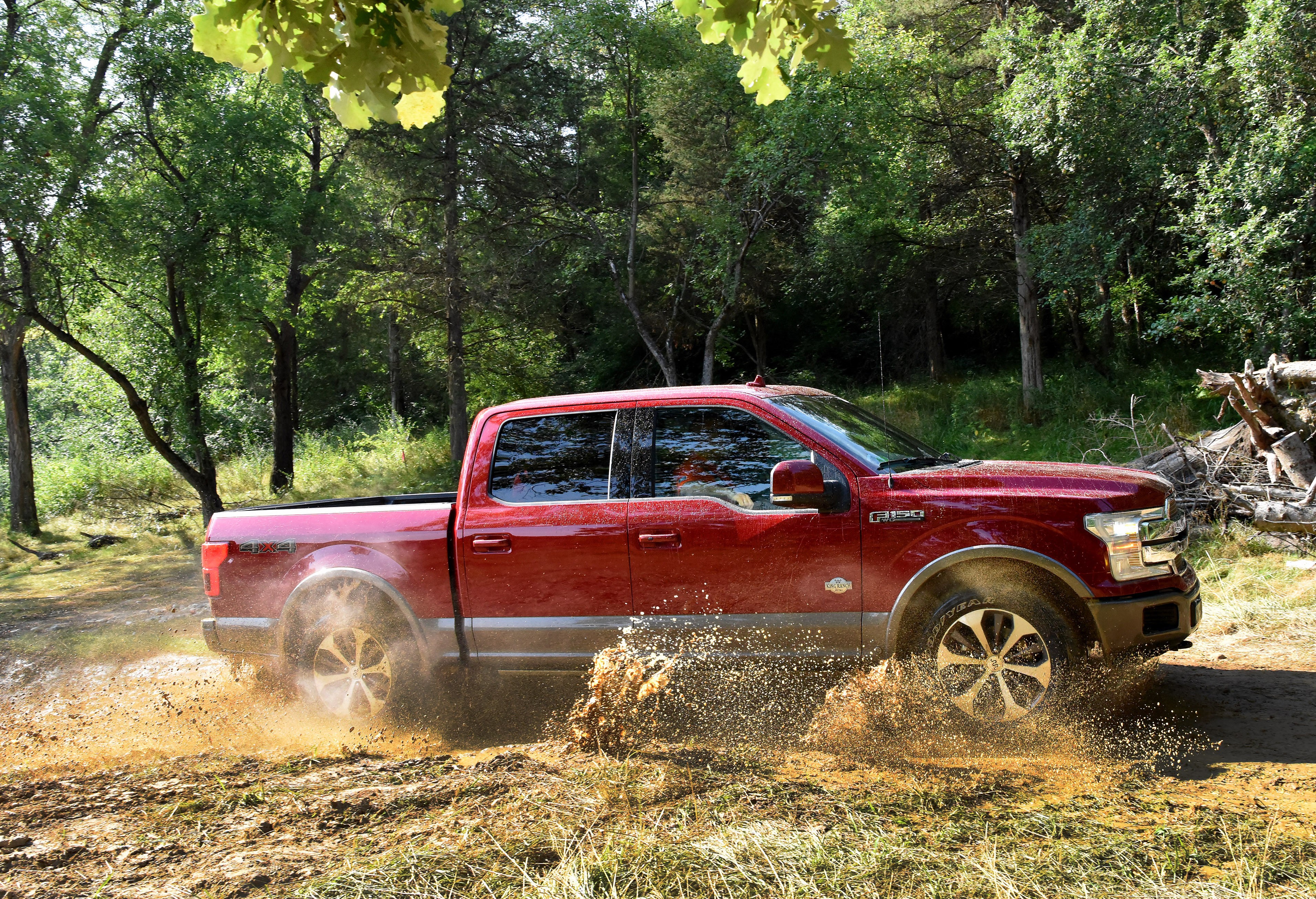 Red 2018 Ford F-150 King Ranch SuperCrew driving through mud HD Wallpaper