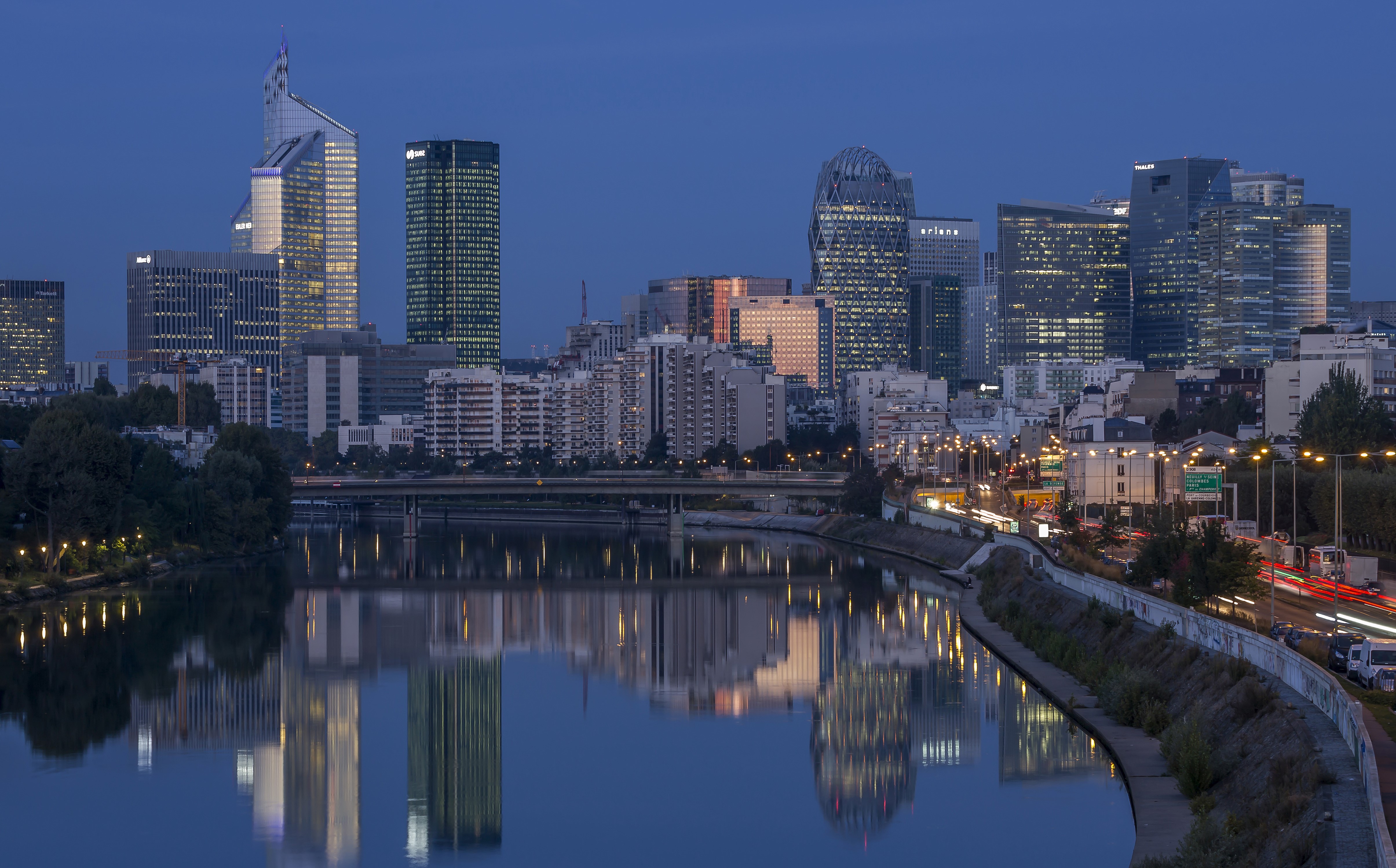 4K Cityscape with River Reflection at Dusk HD Wallpaper