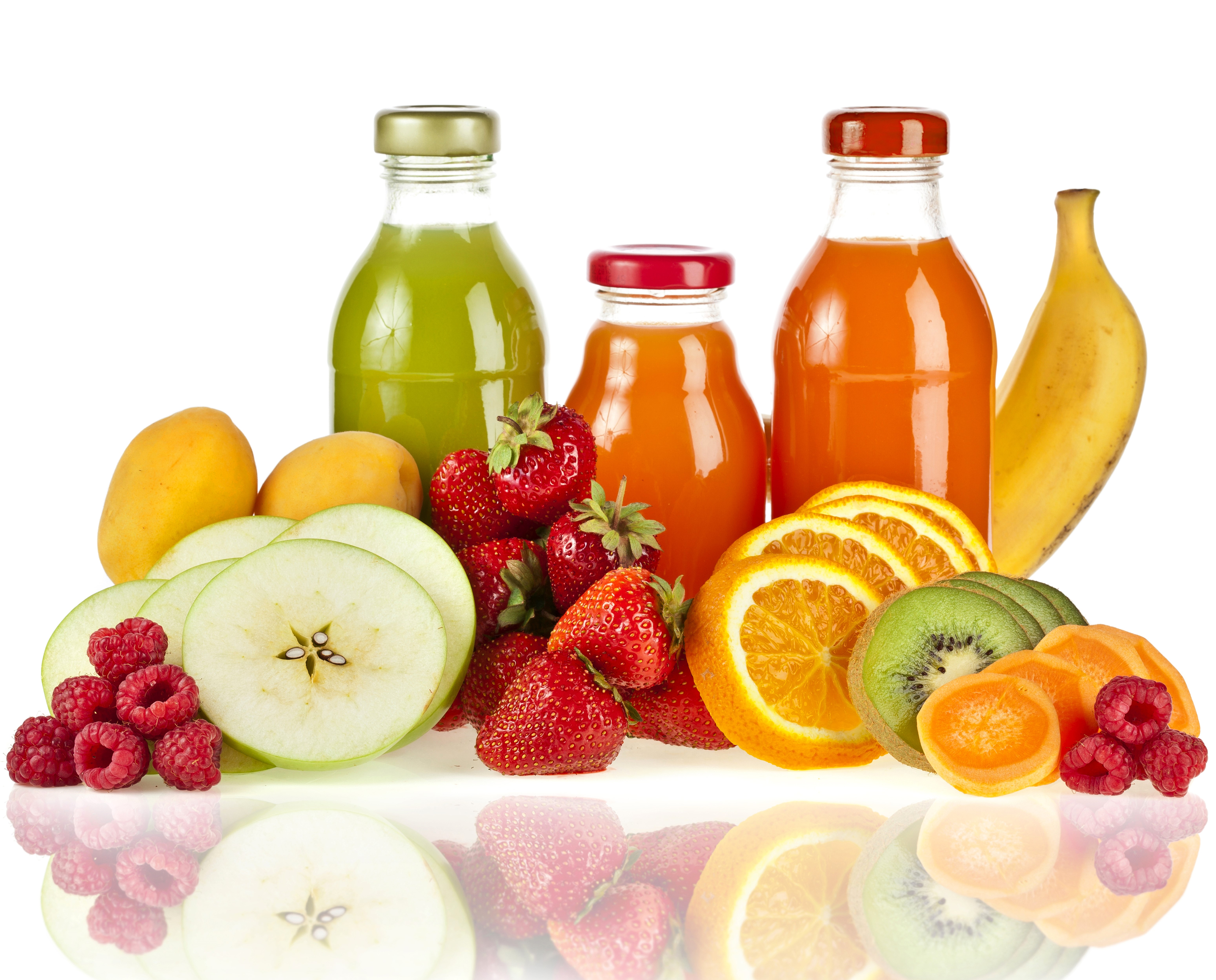 Juice bottles with assorted fruits on white background HD Wallpaper