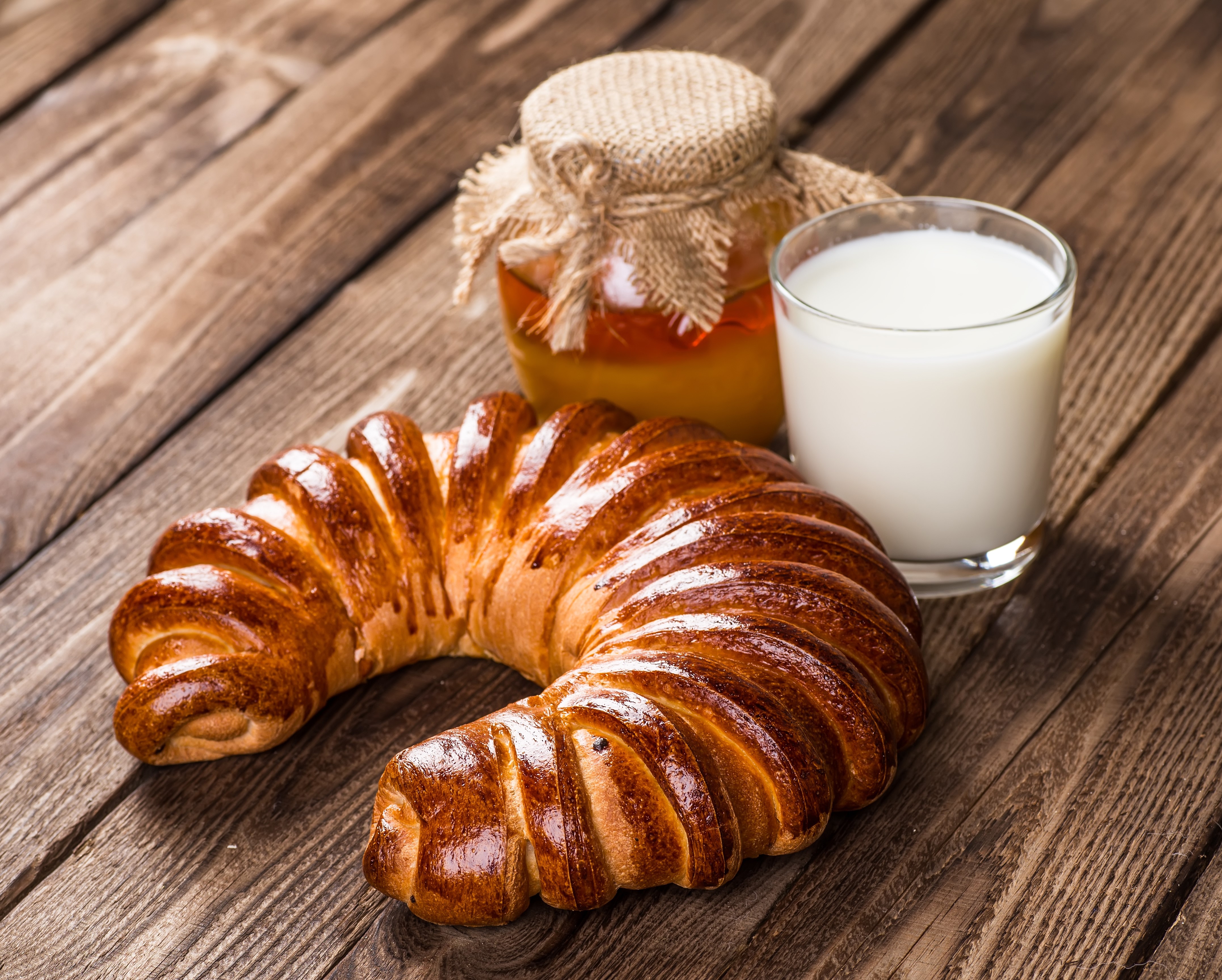Croissant with honey and milk on wood HD Wallpaper