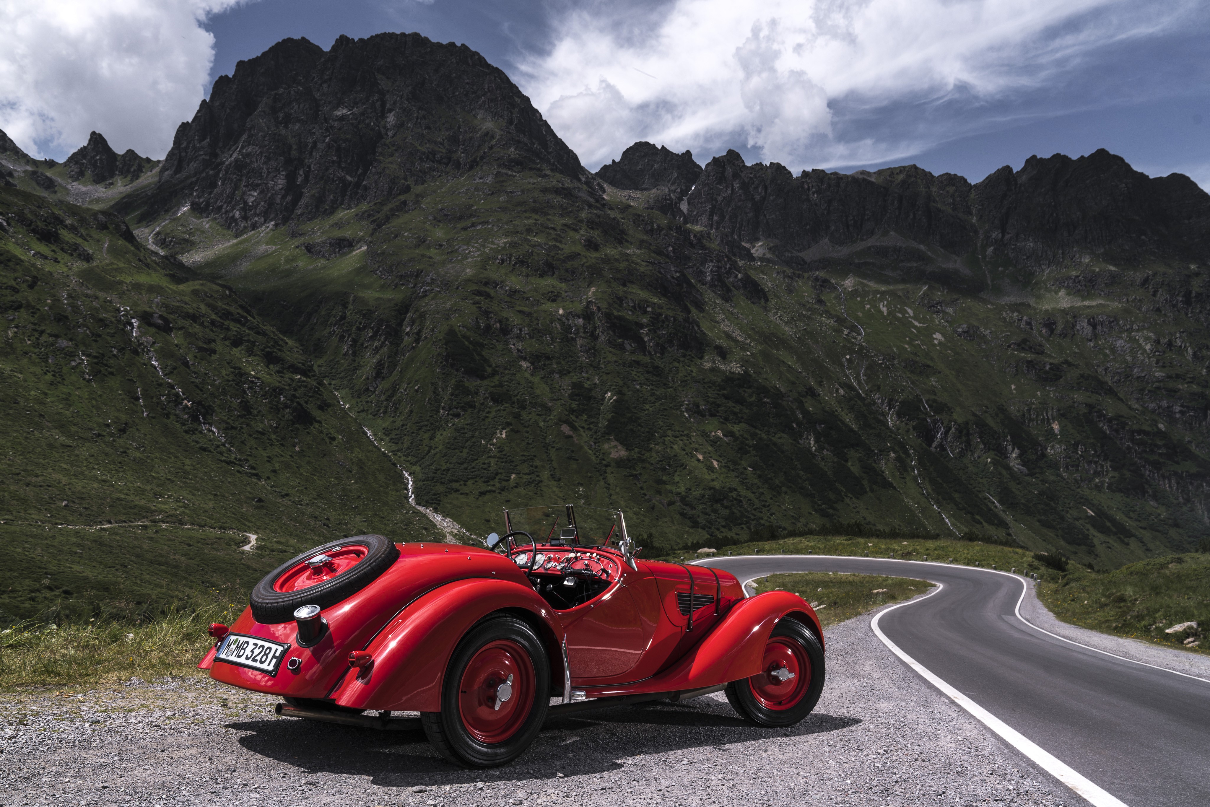 Red BMW 328 Roadster on a mountain road HD Wallpaper
