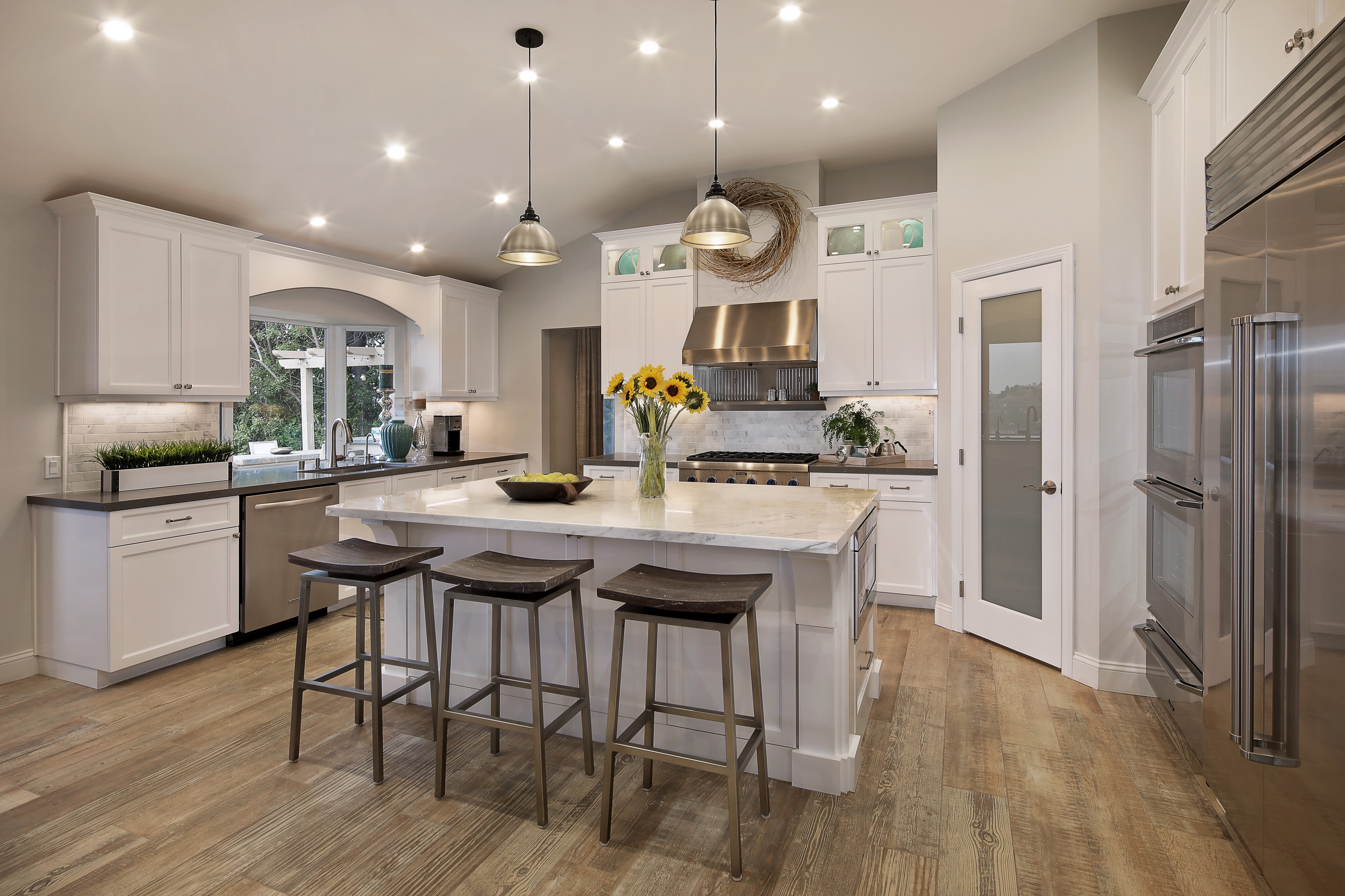 Modern Kitchen with Island and Stainless Steel Appliances HD Wallpaper