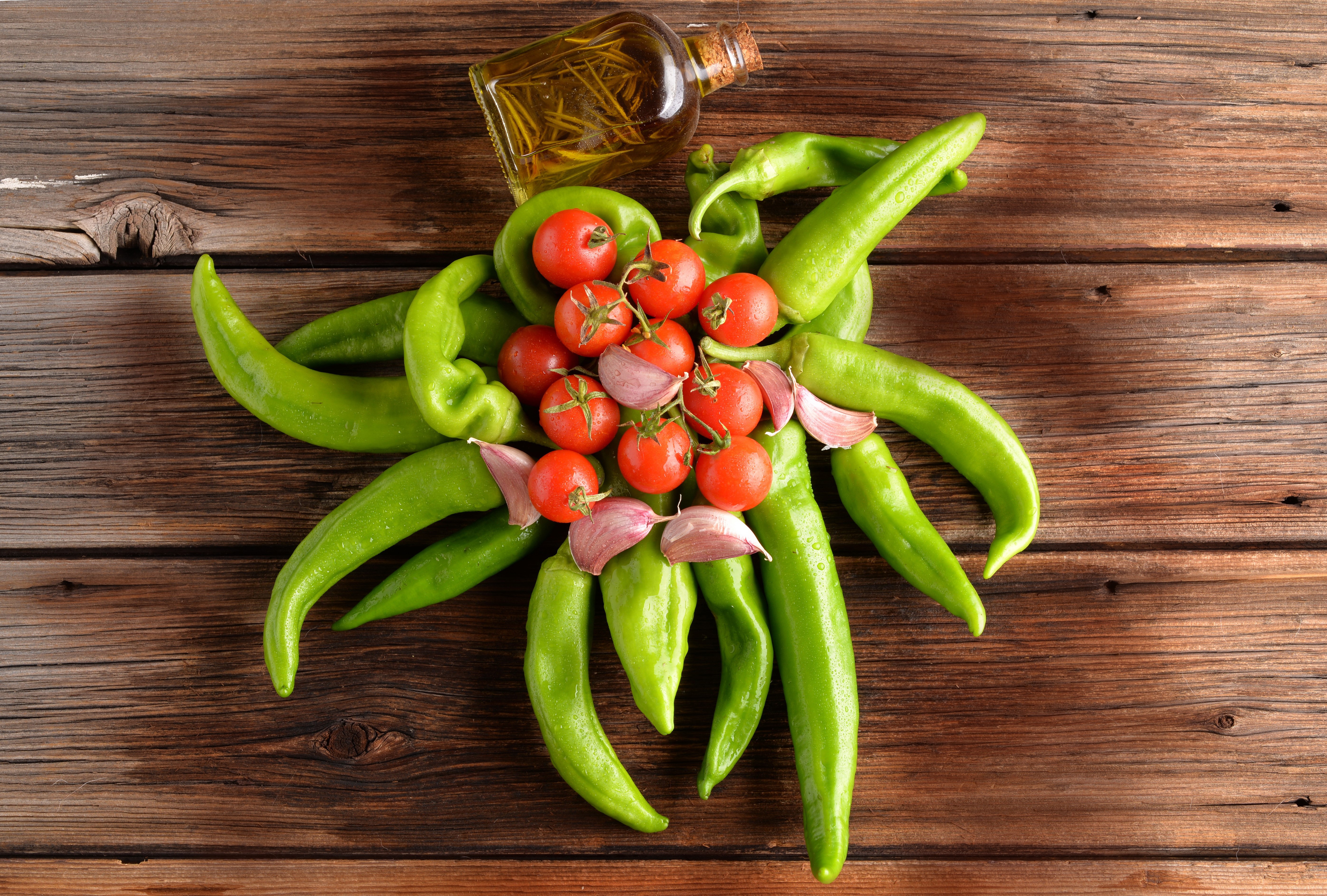 Tomatoes, Garlic, and Peppers with Olive Oil on Wood HD Wallpaper