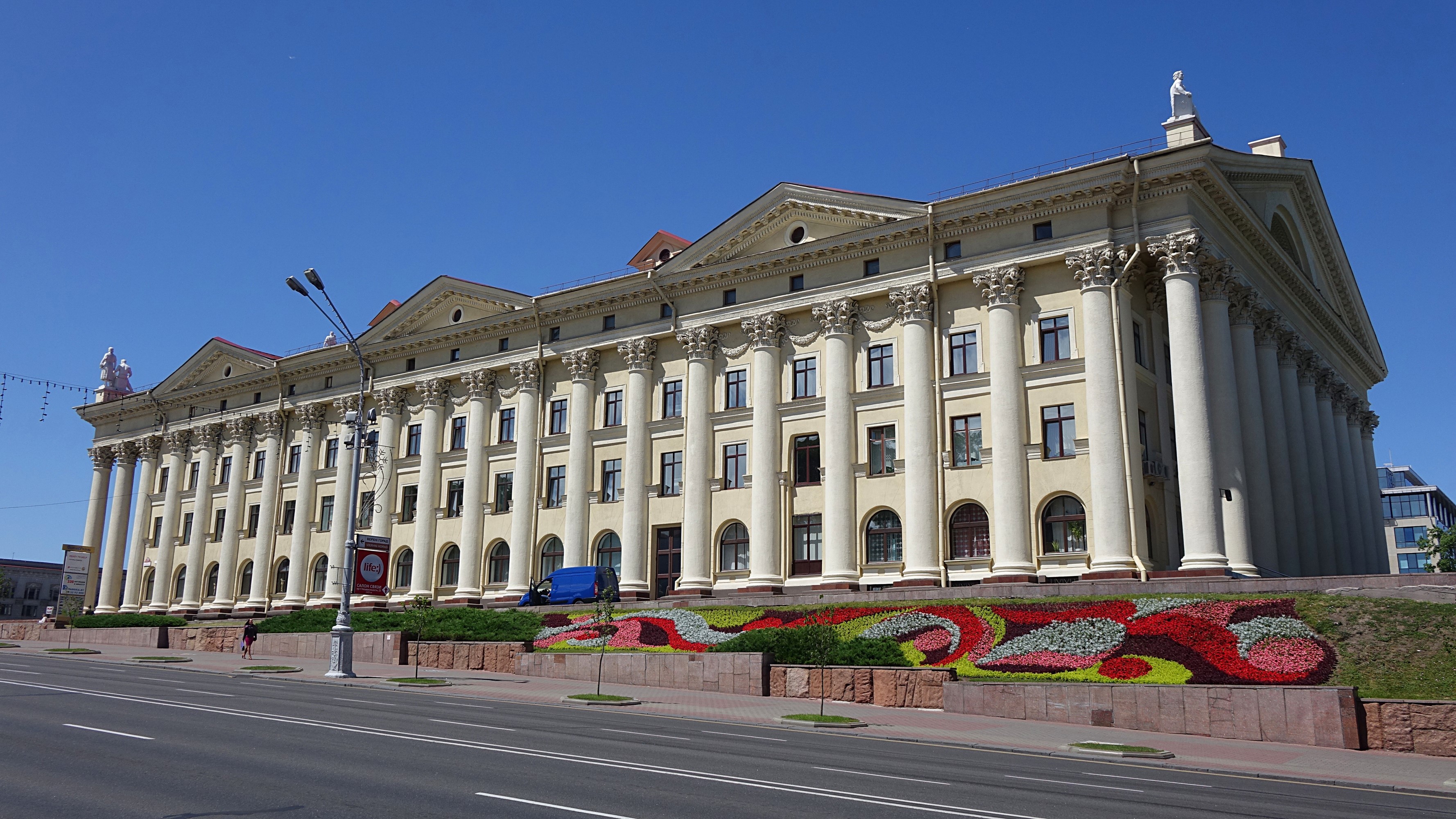 Government building with columns and flower beds in Minsk, Belarus HD Wallpaper