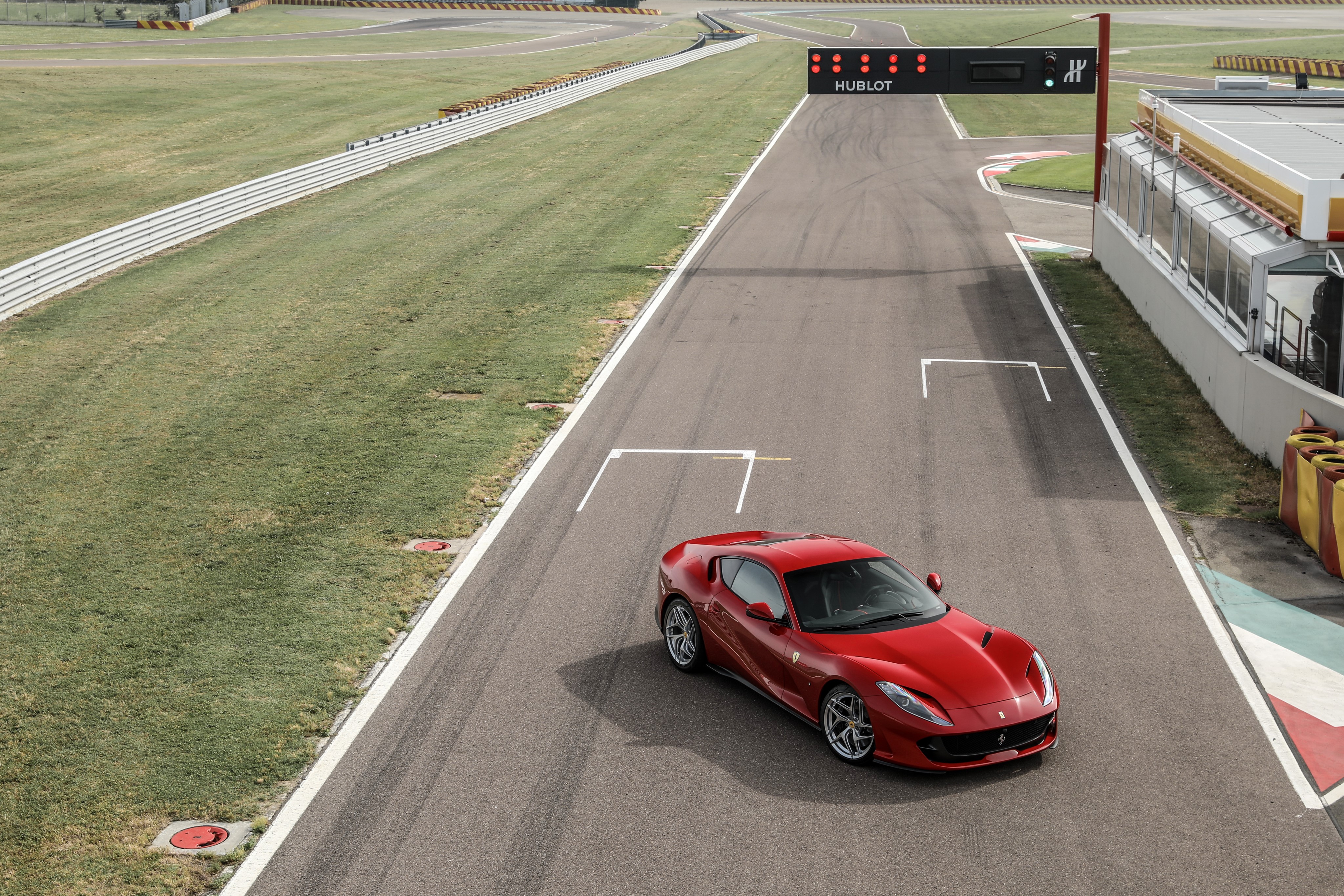 Ferrari 812 Superfast on a Race Track HD Wallpaper