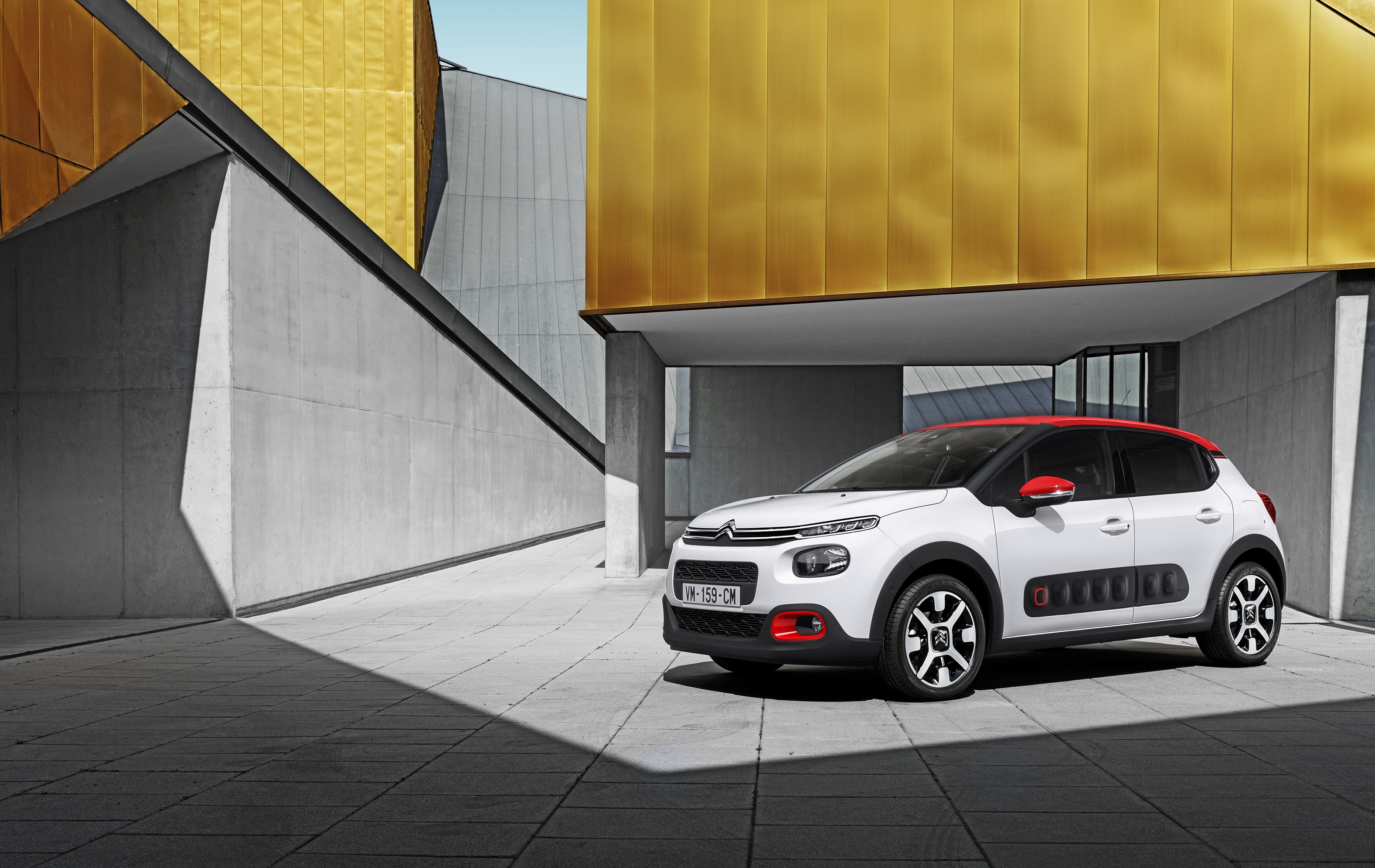 White Citroen C3 parked near a modern building HD Wallpaper