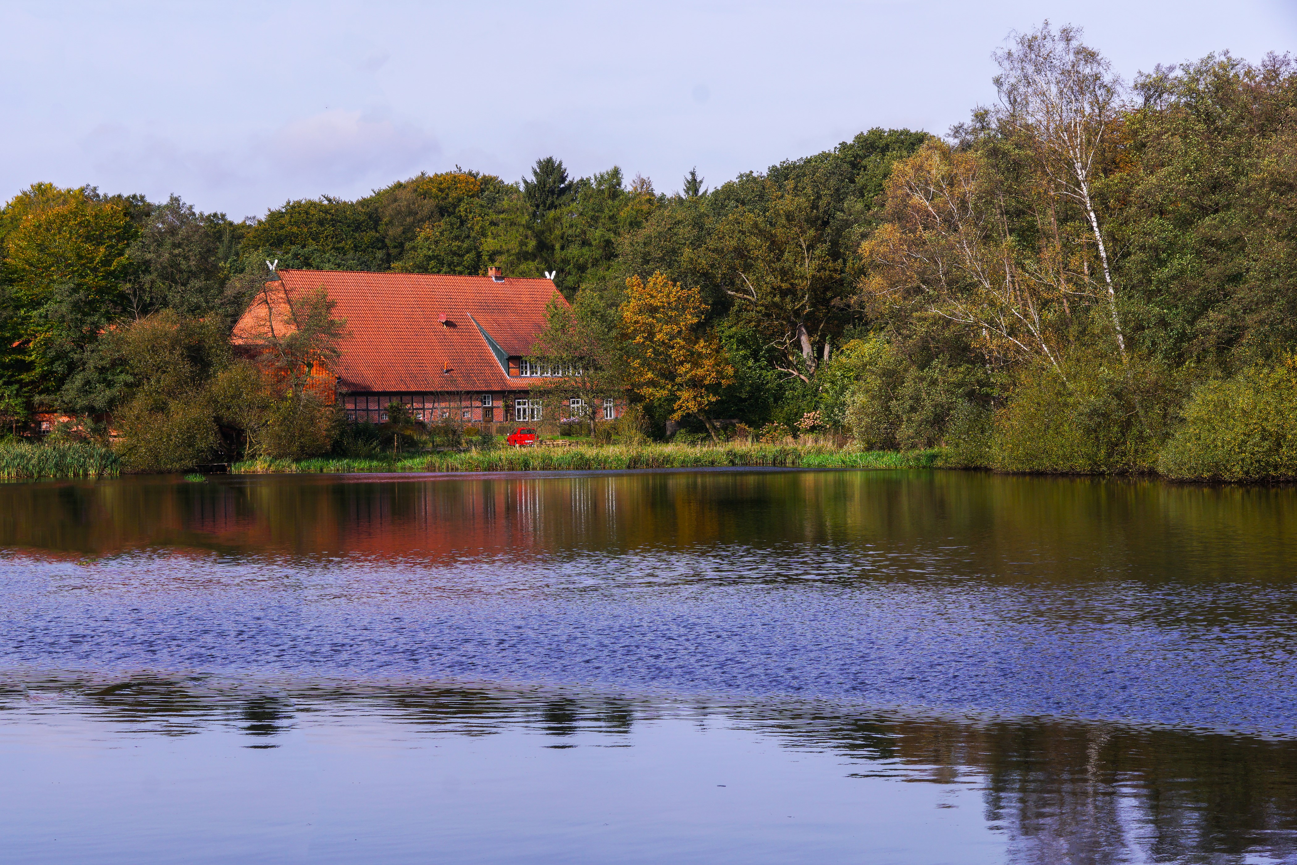 House by a lake in Ahausen, Germany HD Wallpaper