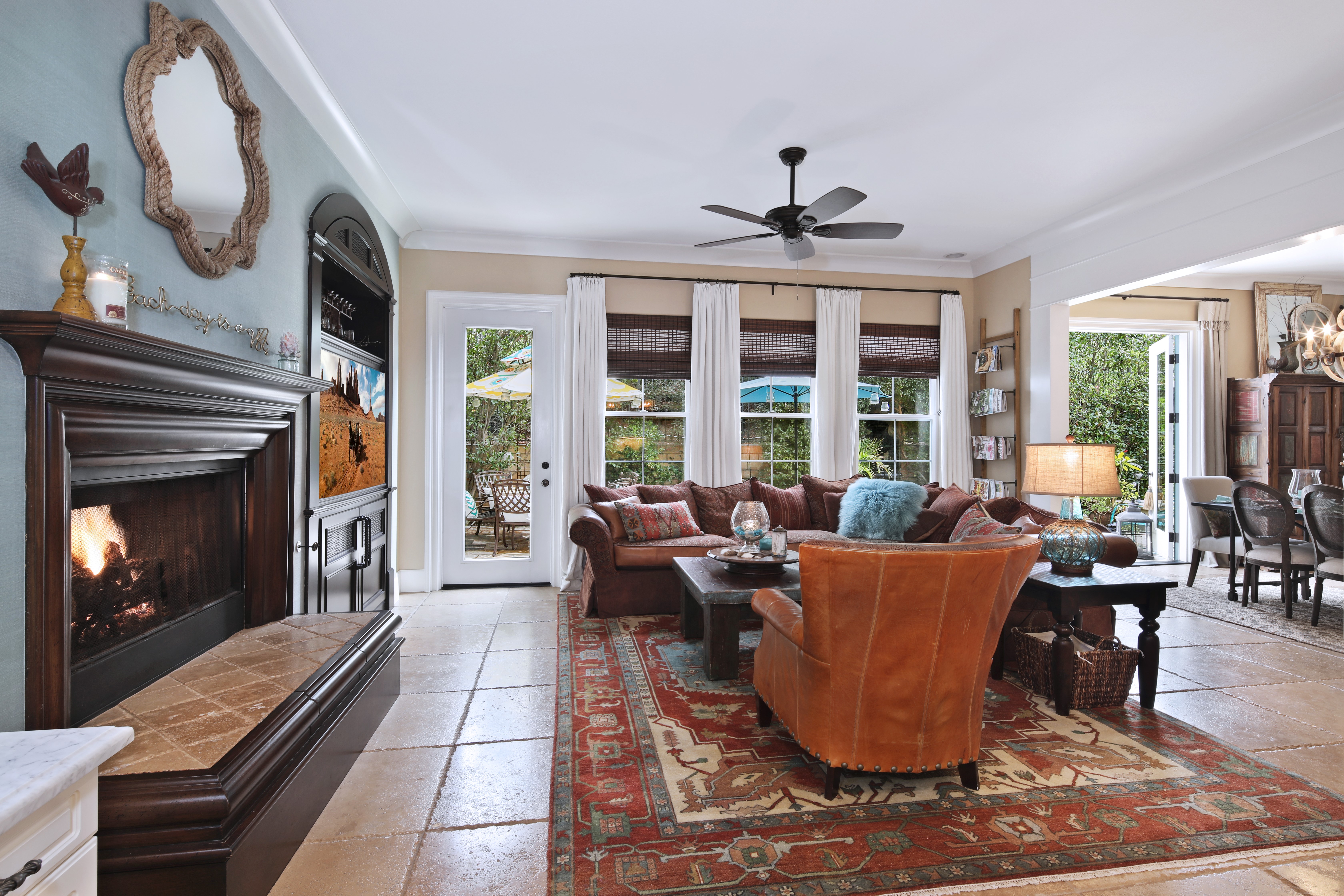 Living room with fireplace and outdoor view HD Wallpaper
