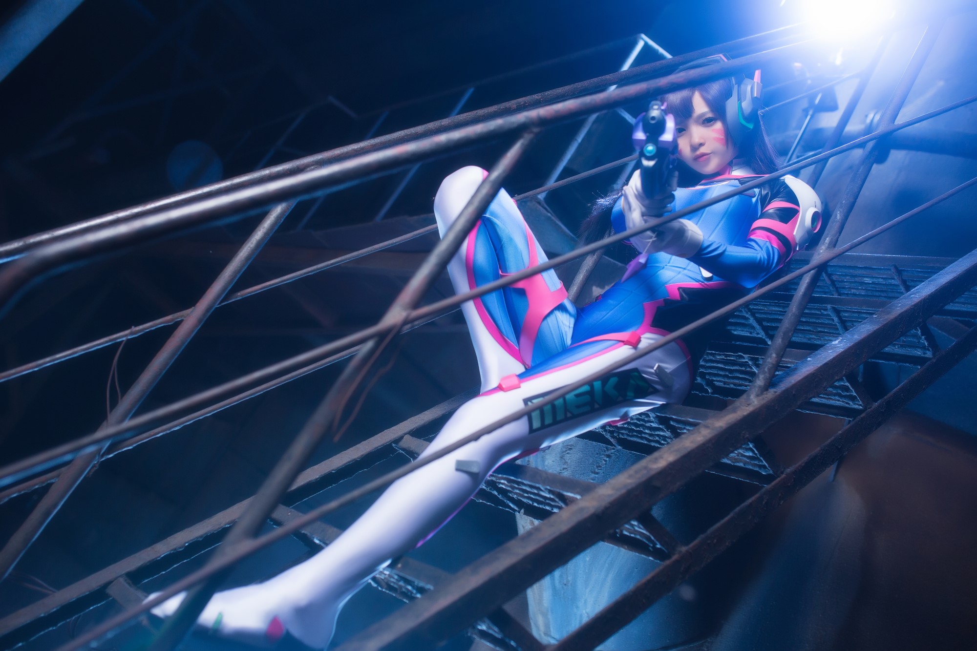 D.Va from Overwatch posing on stairs with a gun HD Wallpaper