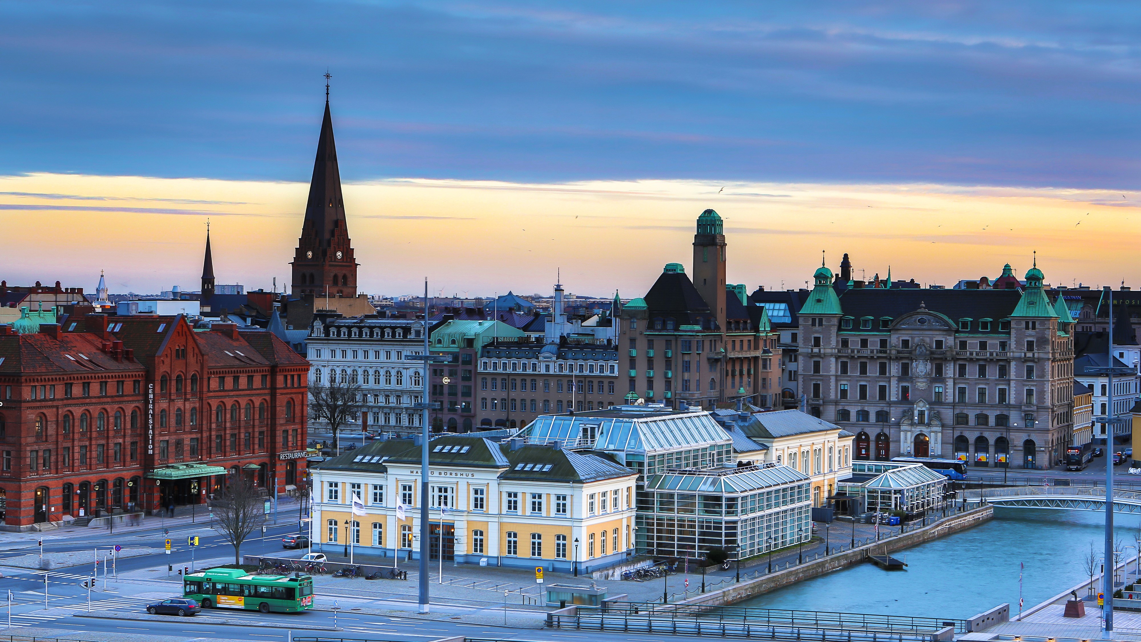 Malmo, Sweden cityscape with river and church spires HD Wallpaper