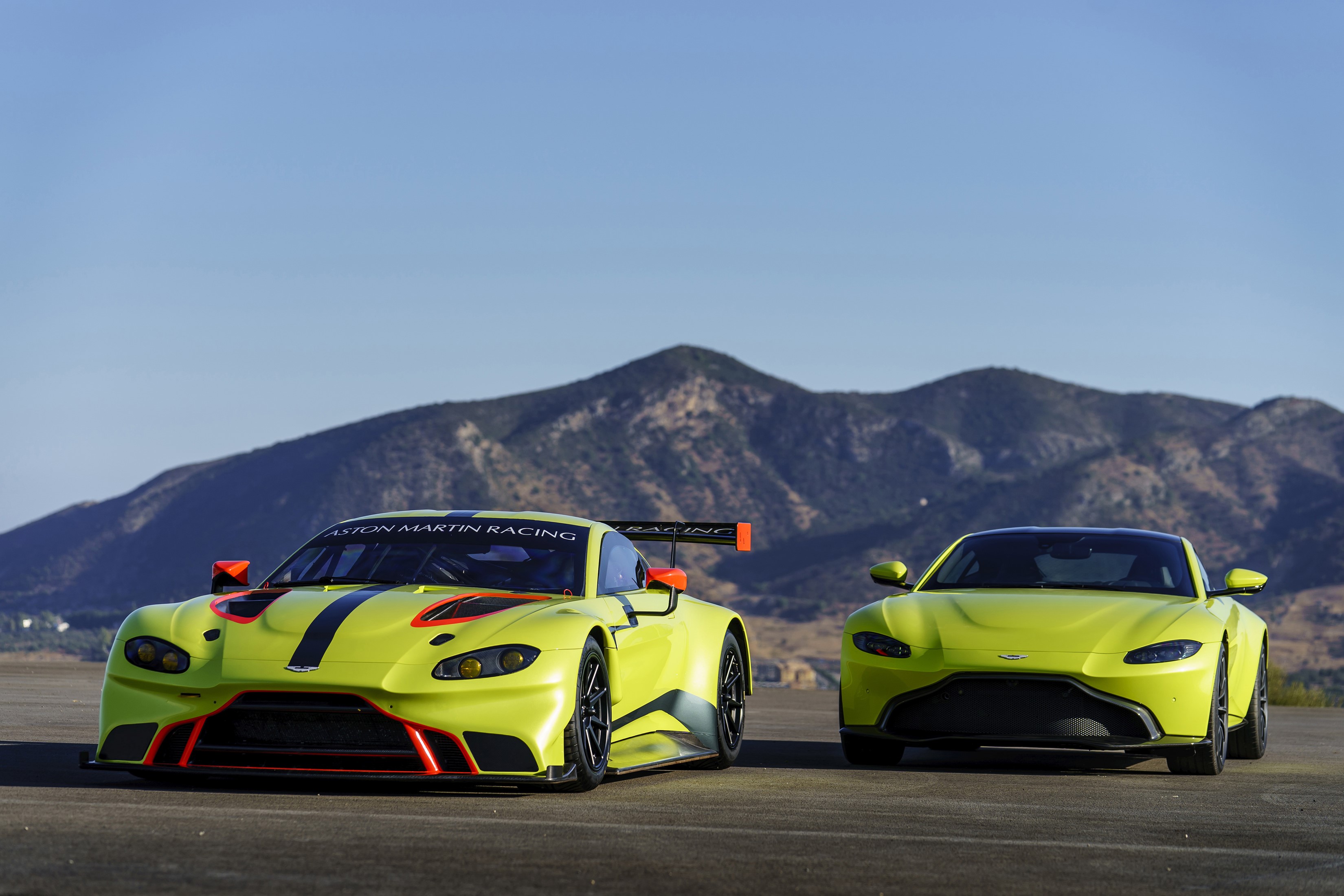 Two Aston Martin Vantage race cars HD Wallpaper