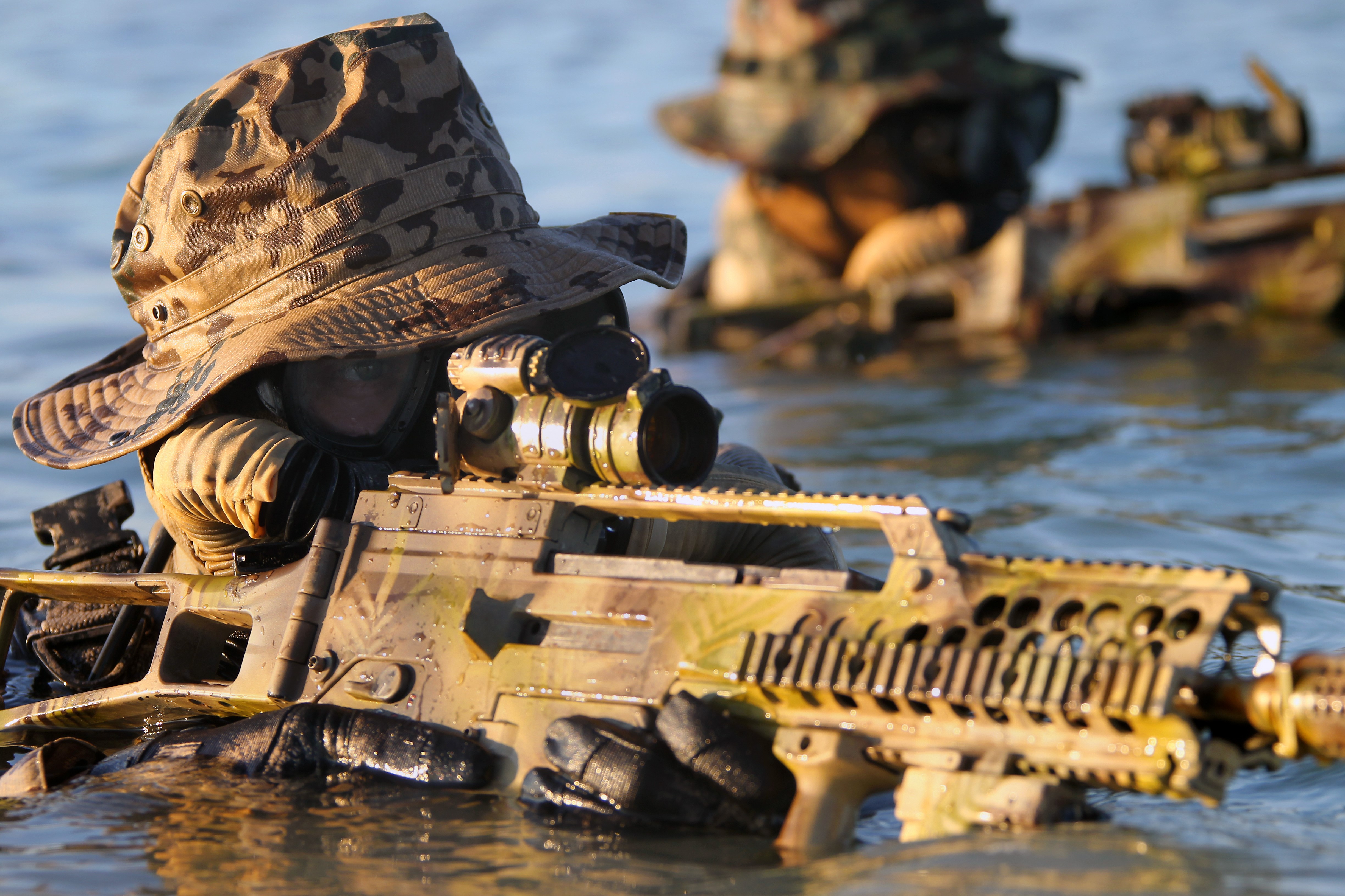 Soldiers in water with assault rifles HD Wallpaper