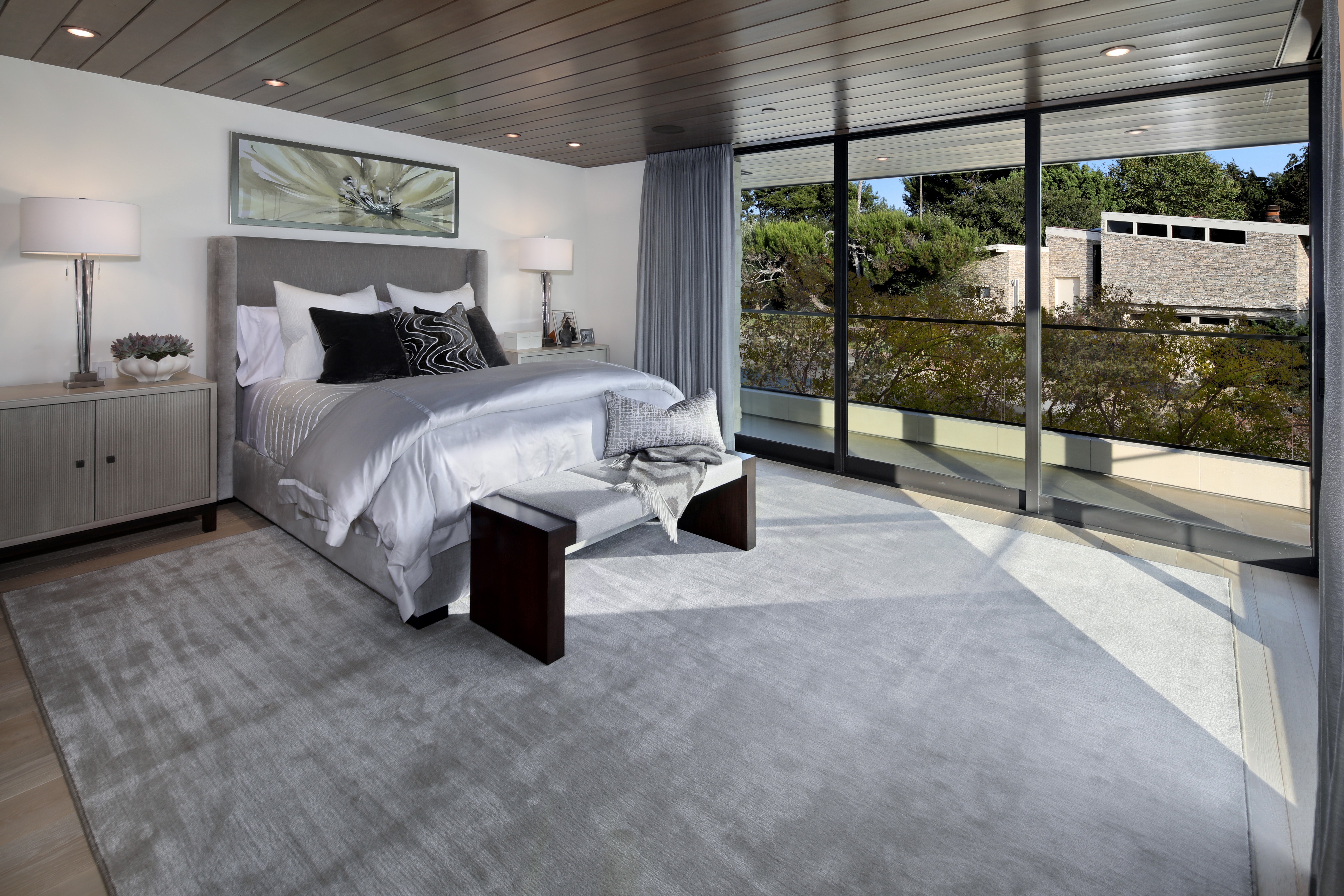 Modern Bedroom with Large Window and Artwork HD Wallpaper
