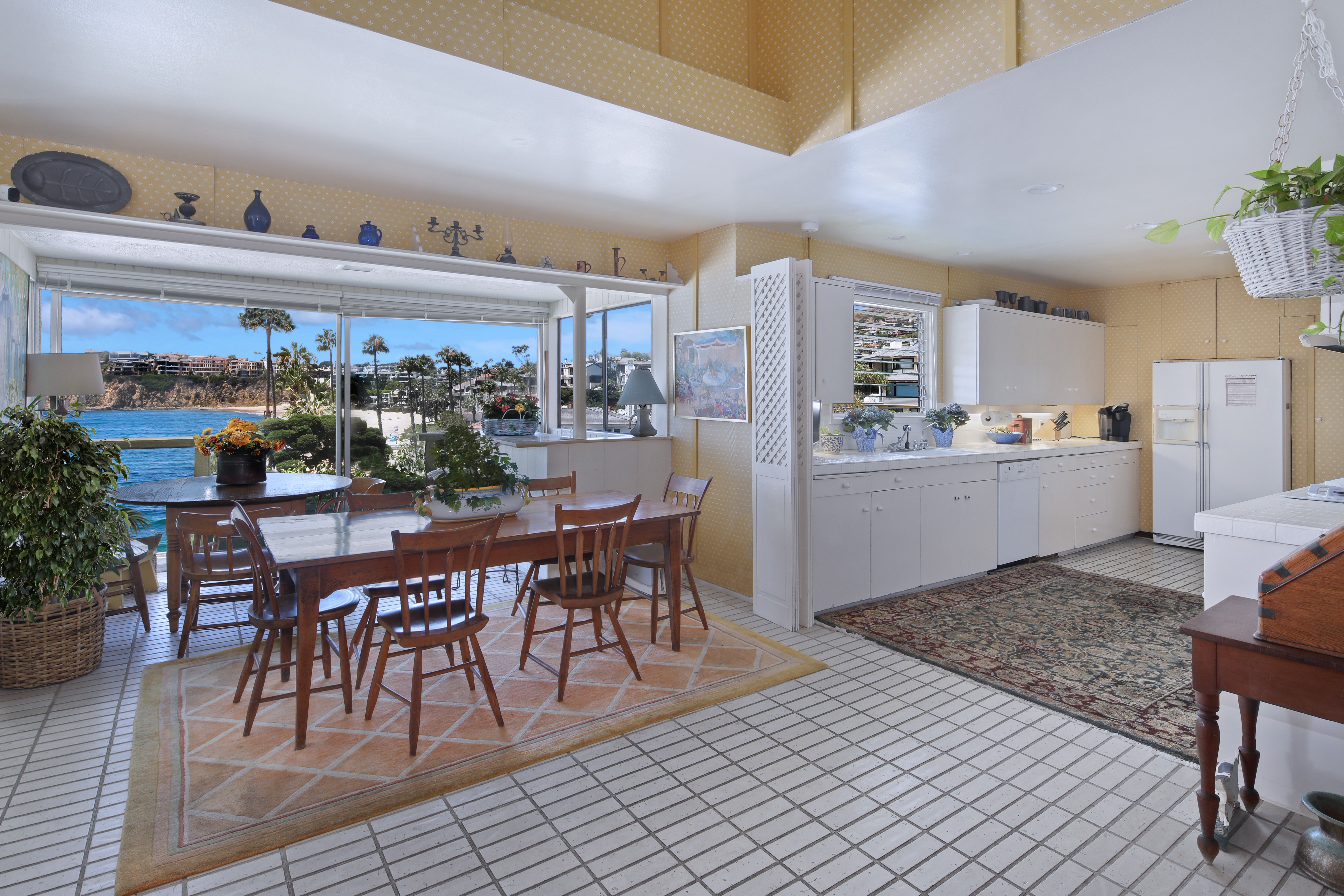 Dining area and kitchen with ocean view HD Wallpaper