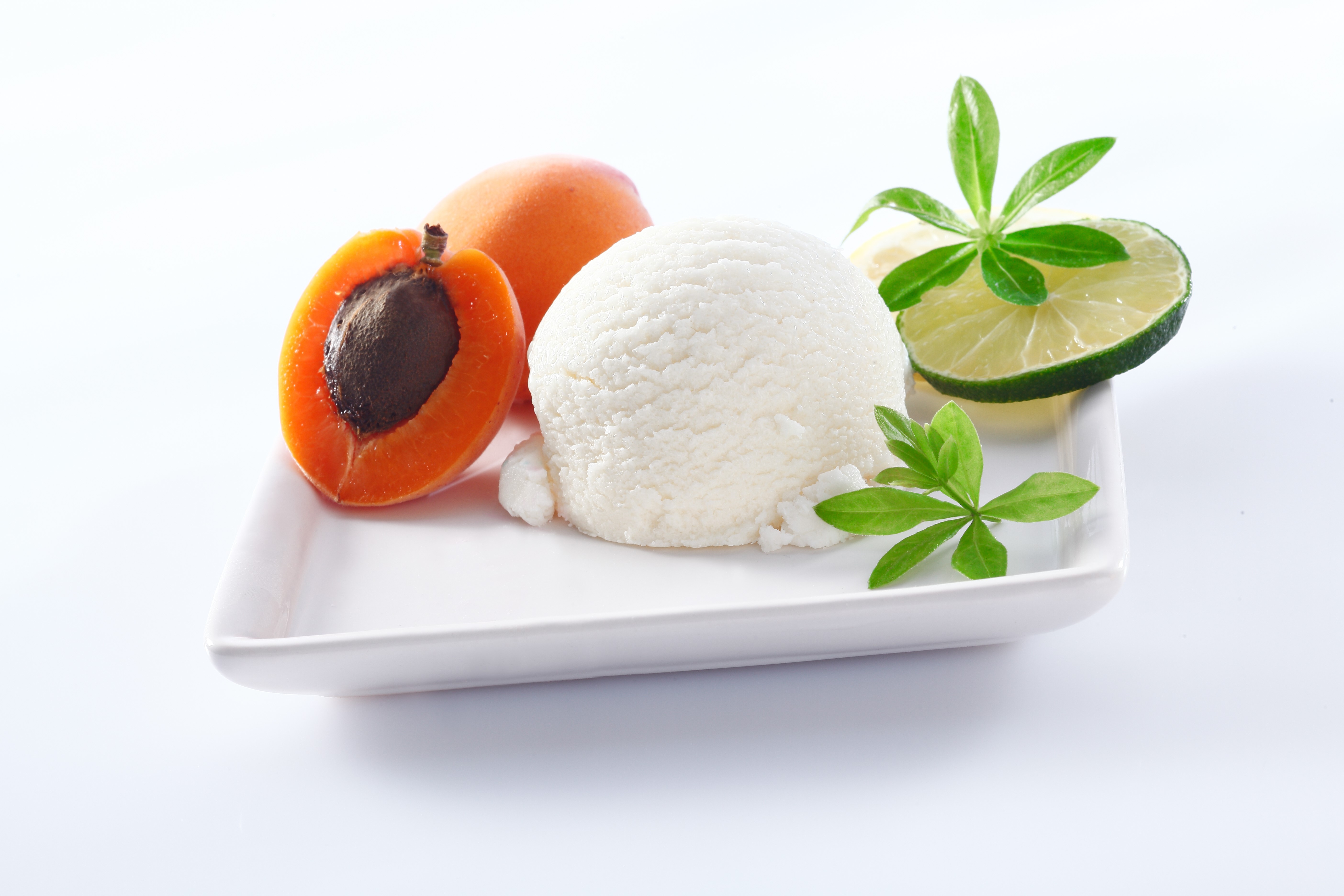 Ice cream scoop with apricots and lime slice HD Wallpaper