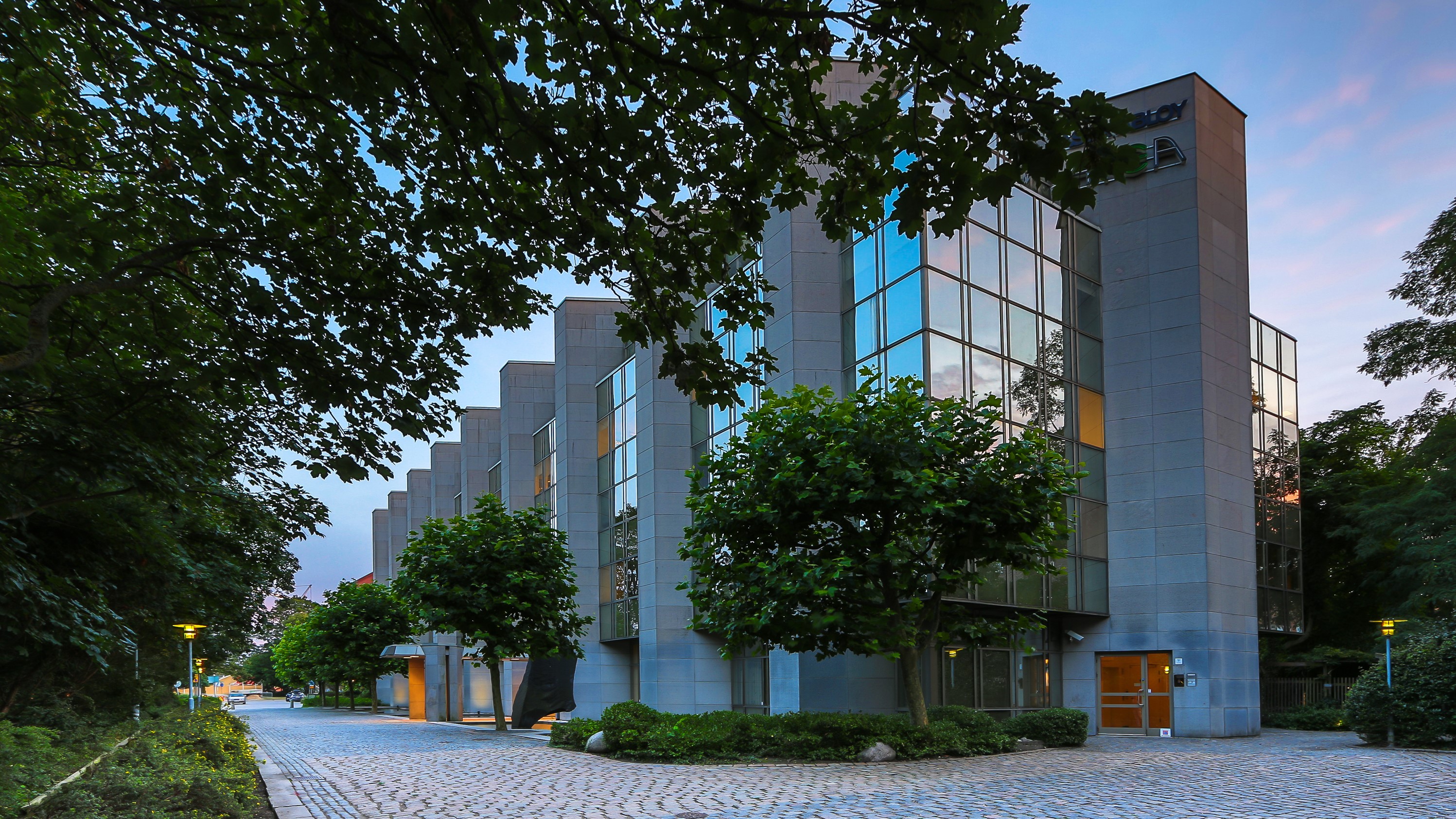 Modern building with glass windows in Malmo, Sweden HD Wallpaper
