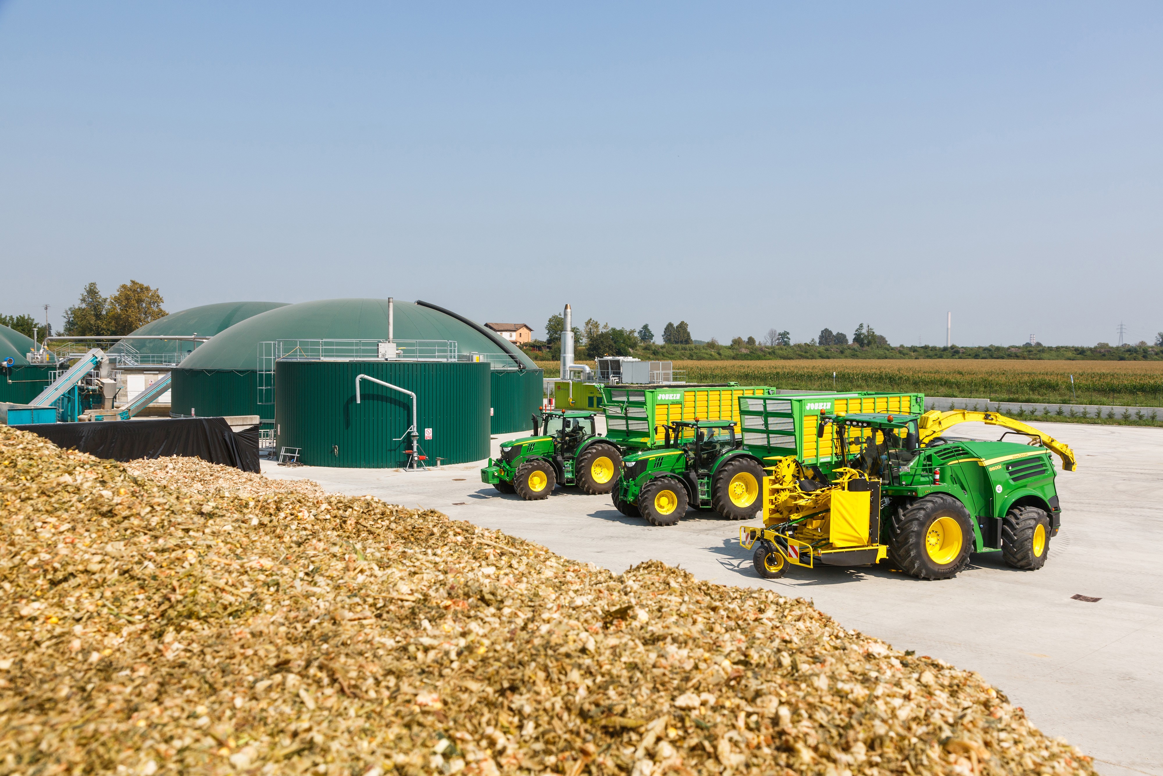 John Deere 8600i agricultural machinery at biogas plant HD Wallpaper