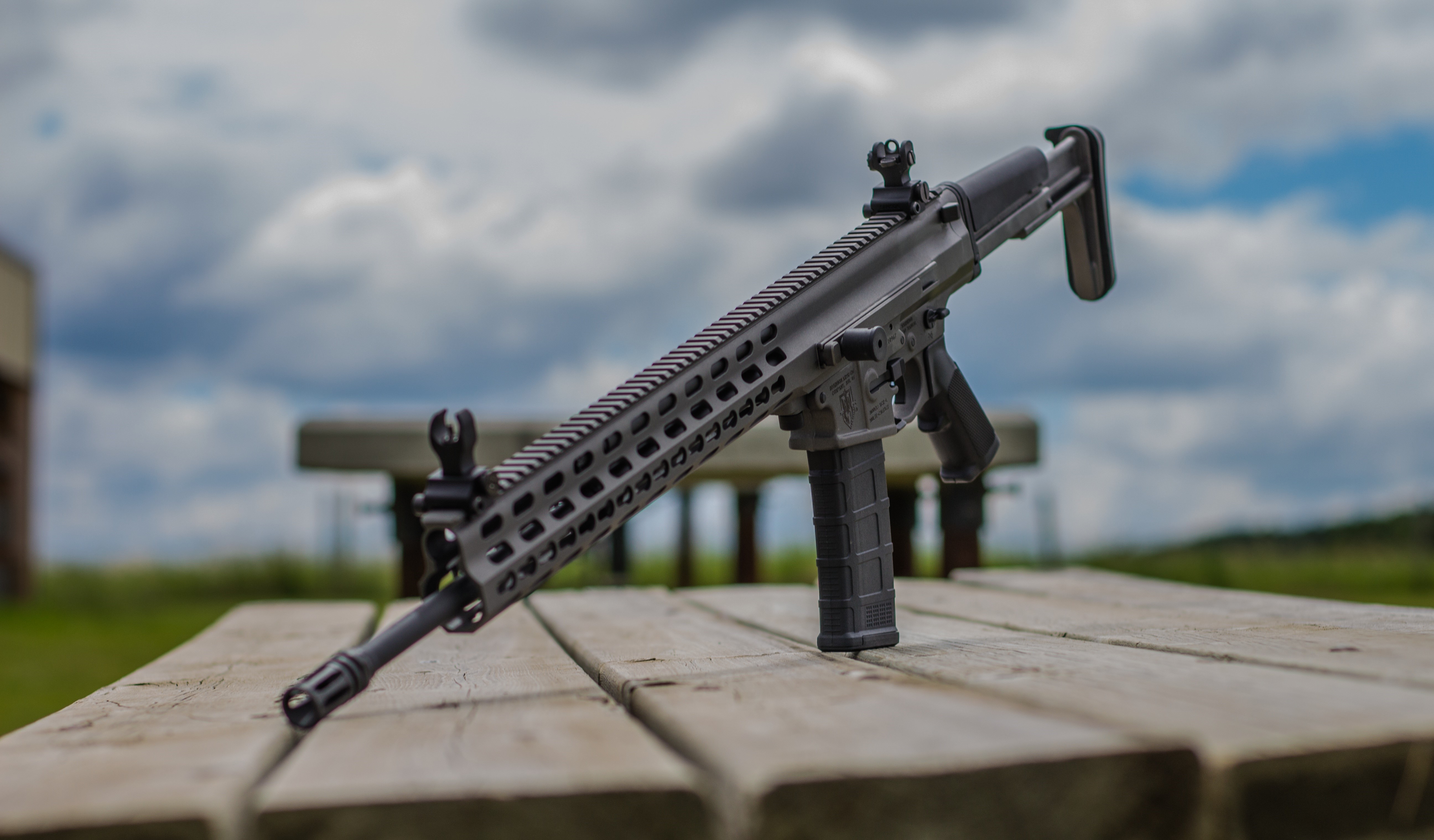 Arms XCR Rifle on a Wooden Table HD Wallpaper