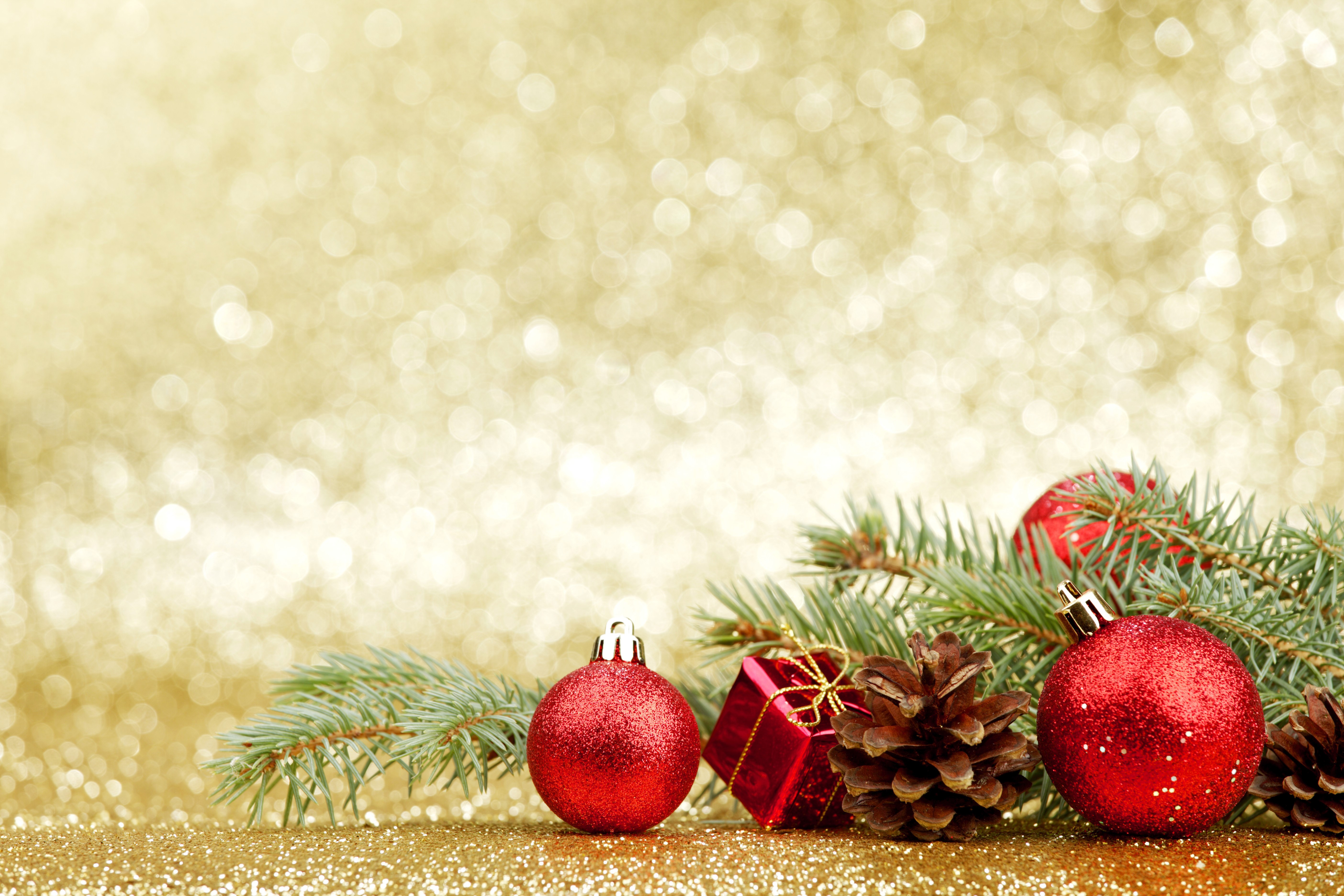 Christmas ornaments and pine cones on branches HD Wallpaper
