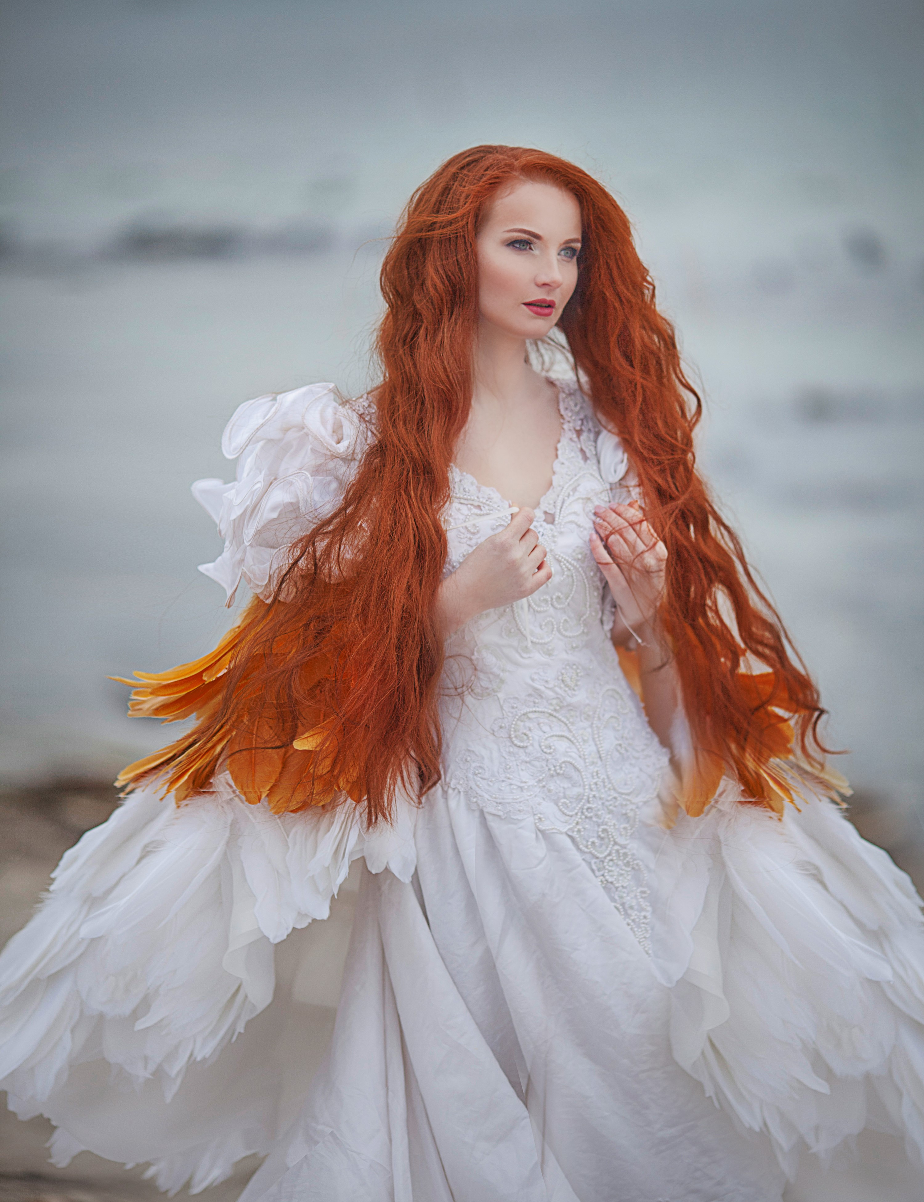 Redhead woman in a white dress with feather accents HD Phone Wallpaper