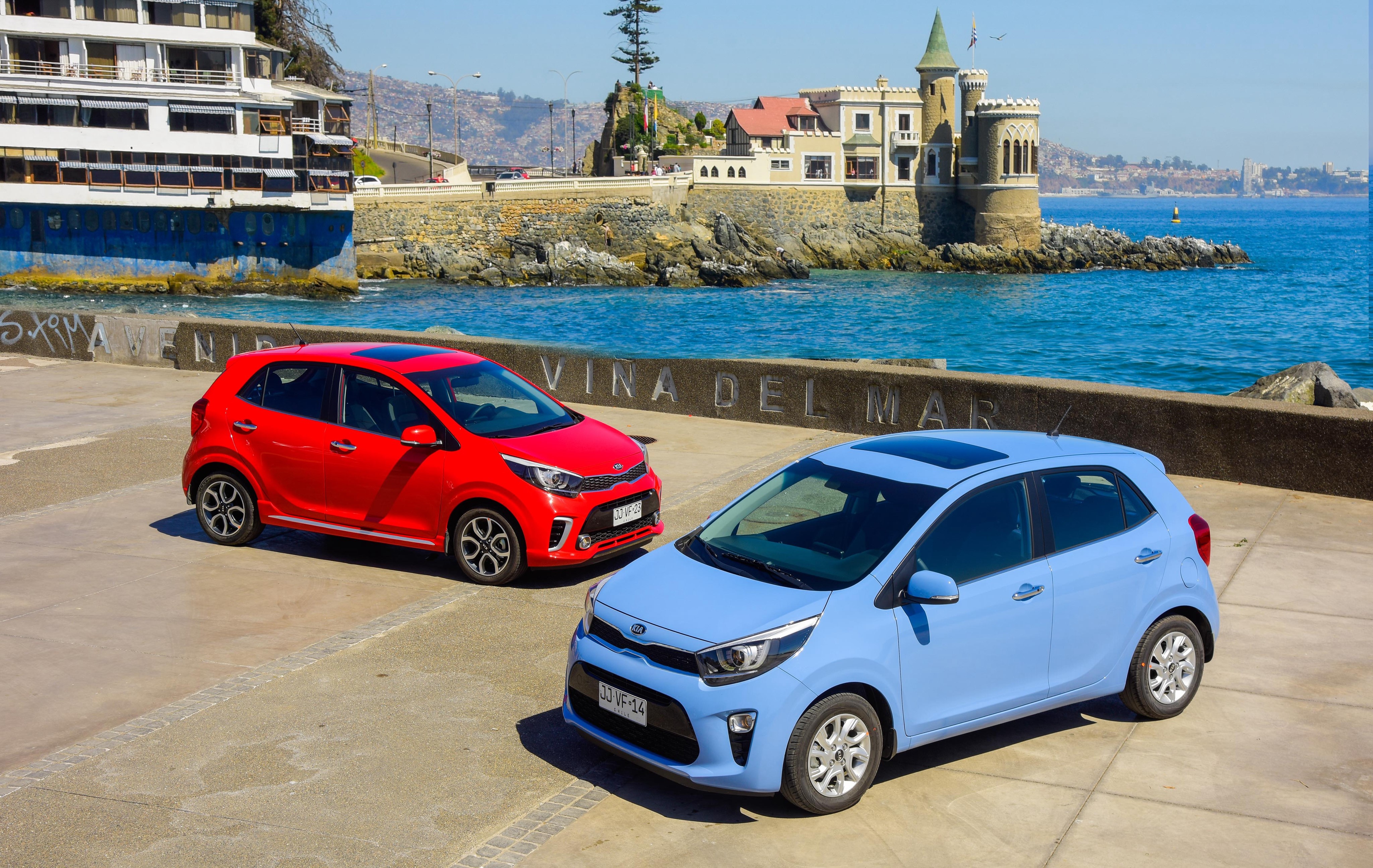 Two Kia Morning cars by the sea HD Wallpaper