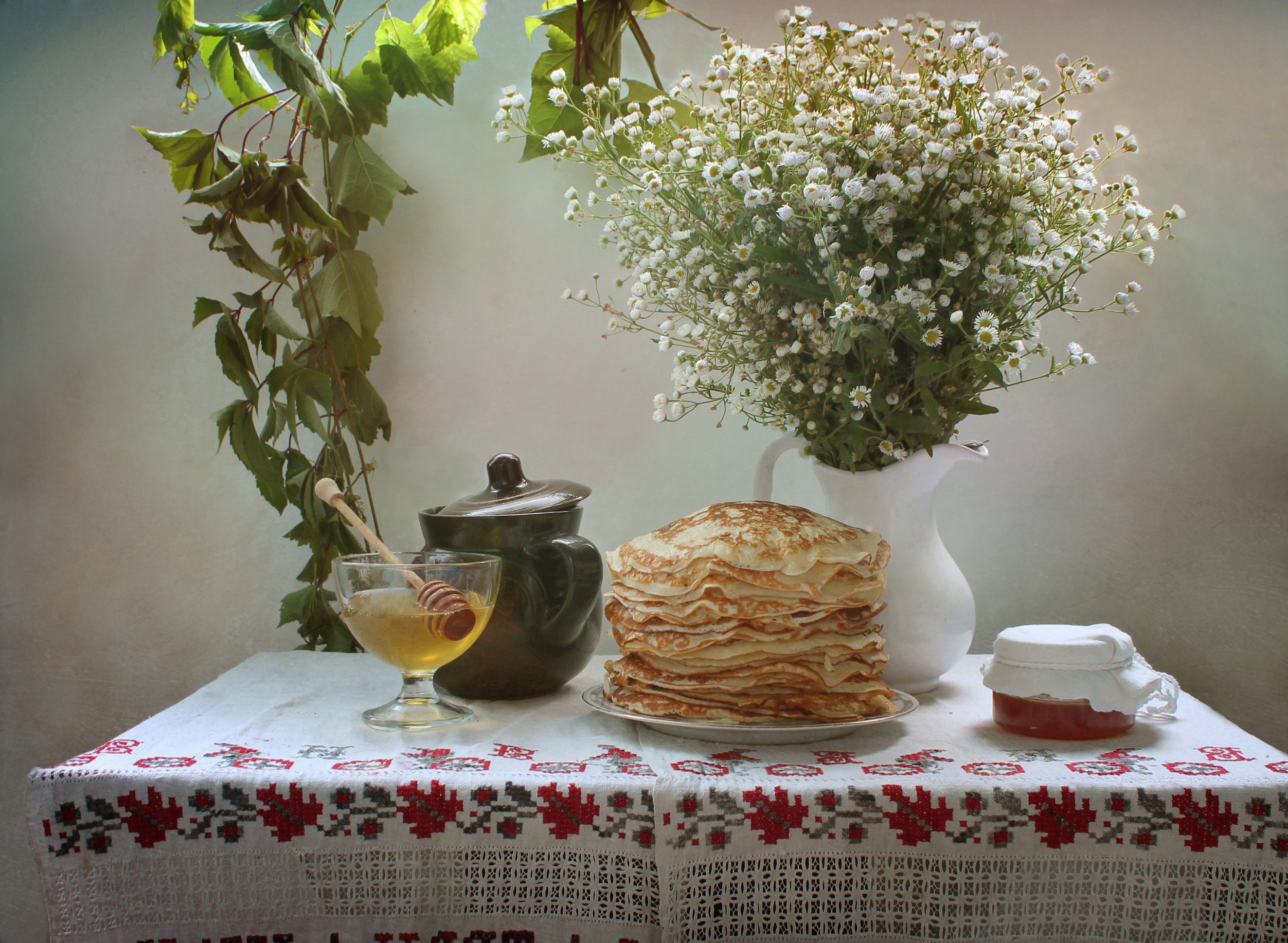 Still life with pancakes, honey, and chamomile bouquet HD Wallpaper