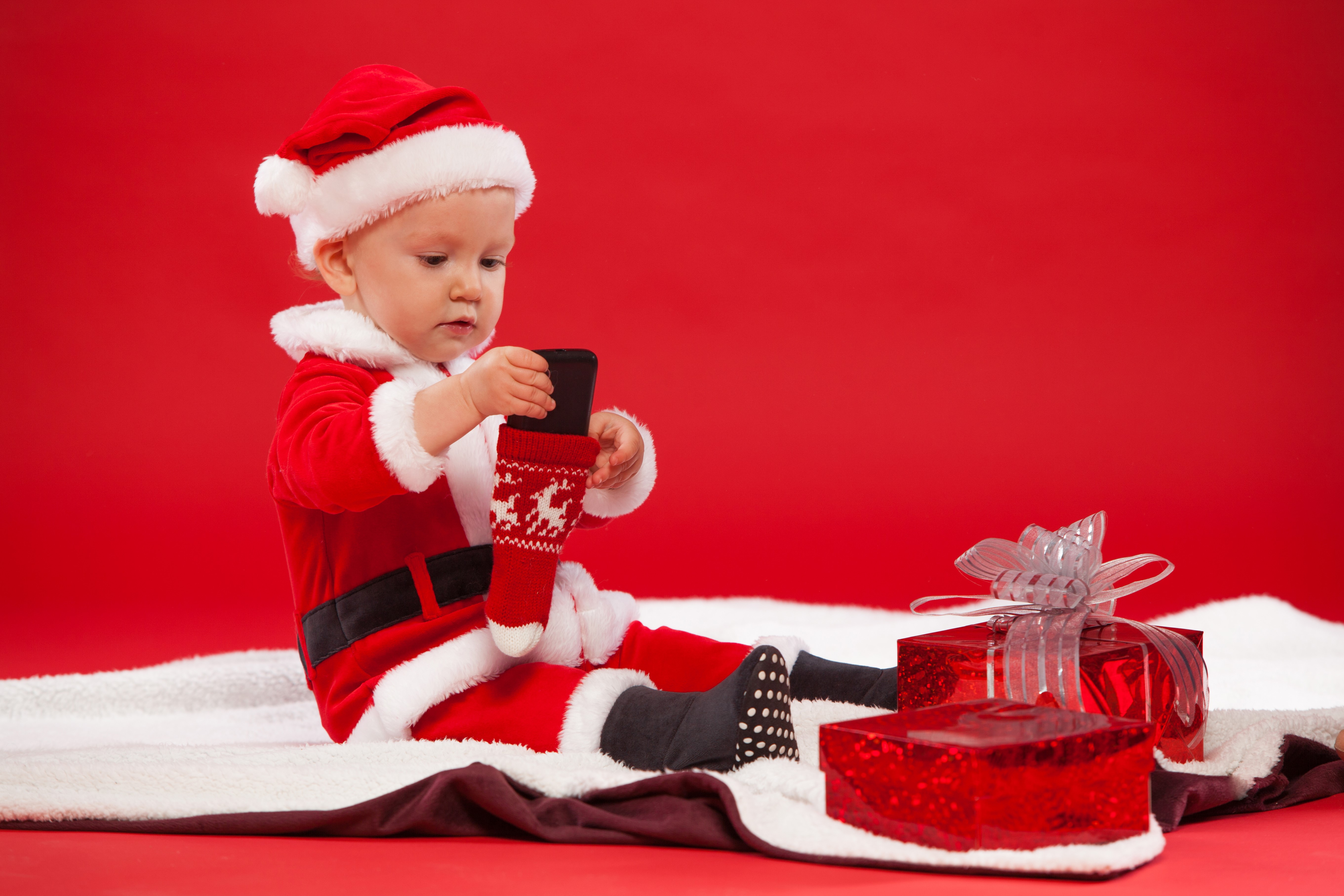 Baby in Santa Claus costume with Christmas gifts HD Wallpaper