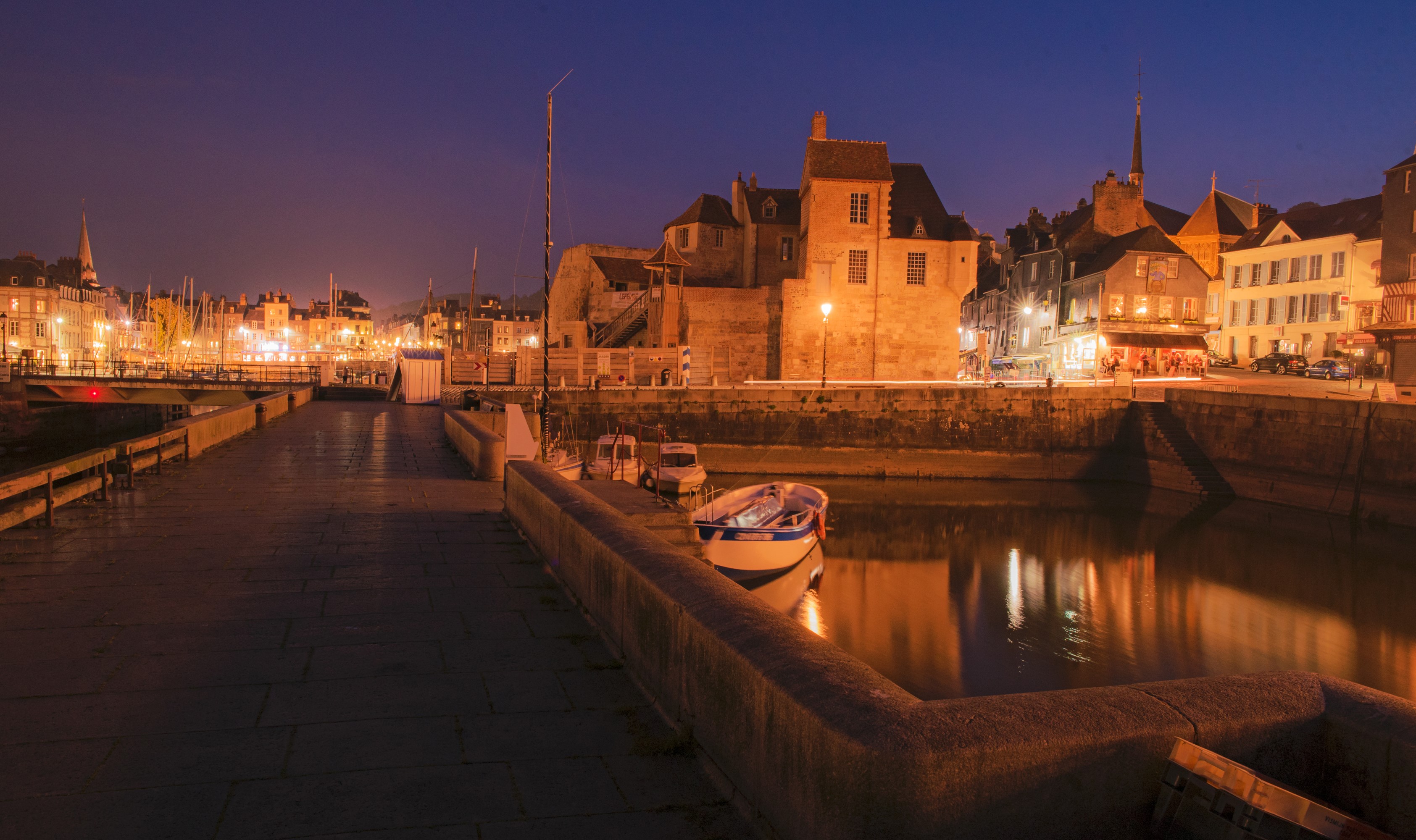 Honfleur, France harbor at night with illuminated buildings and boats HD Wallpaper