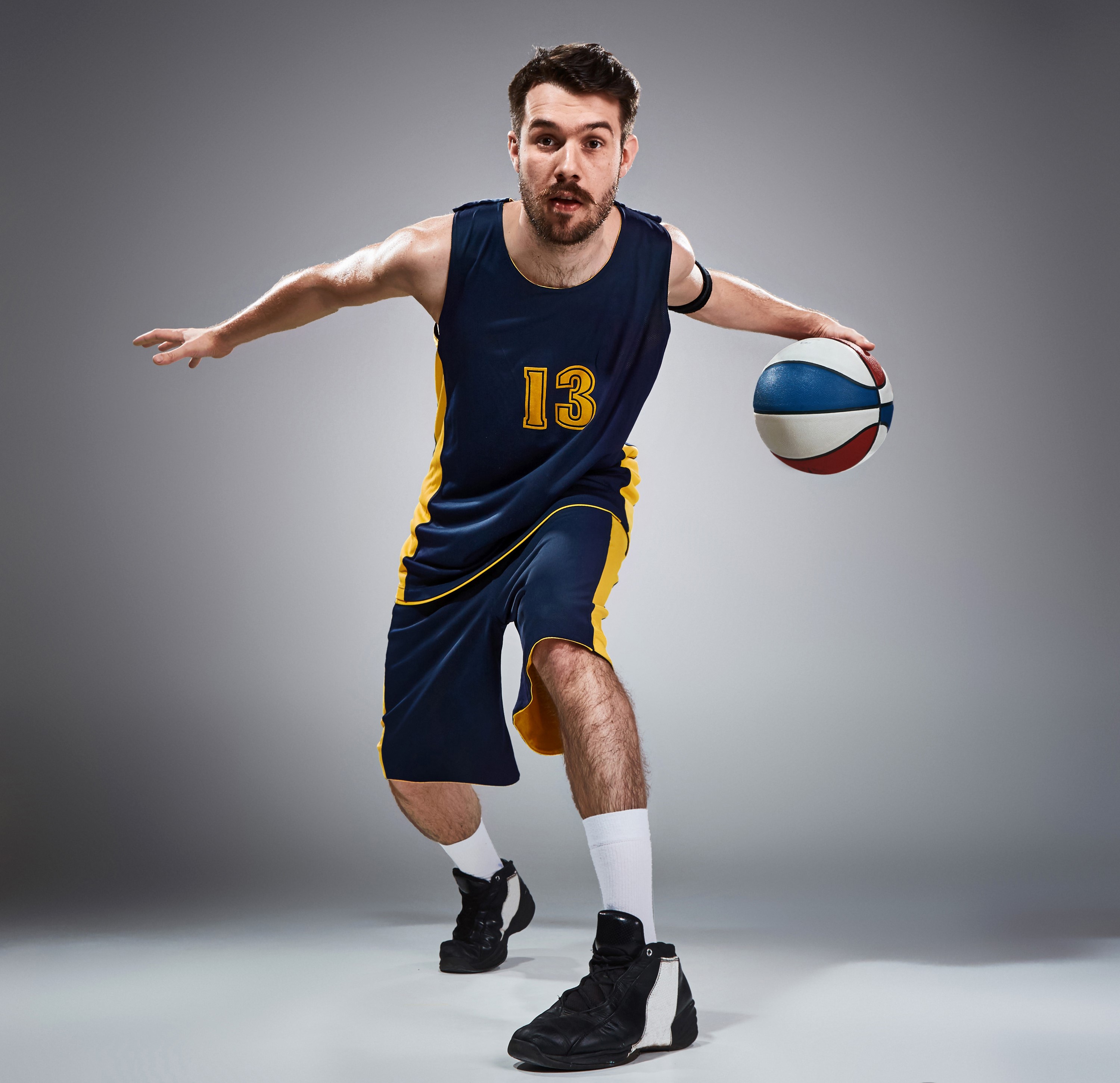 Man in basketball uniform dribbling a ball HD Wallpaper