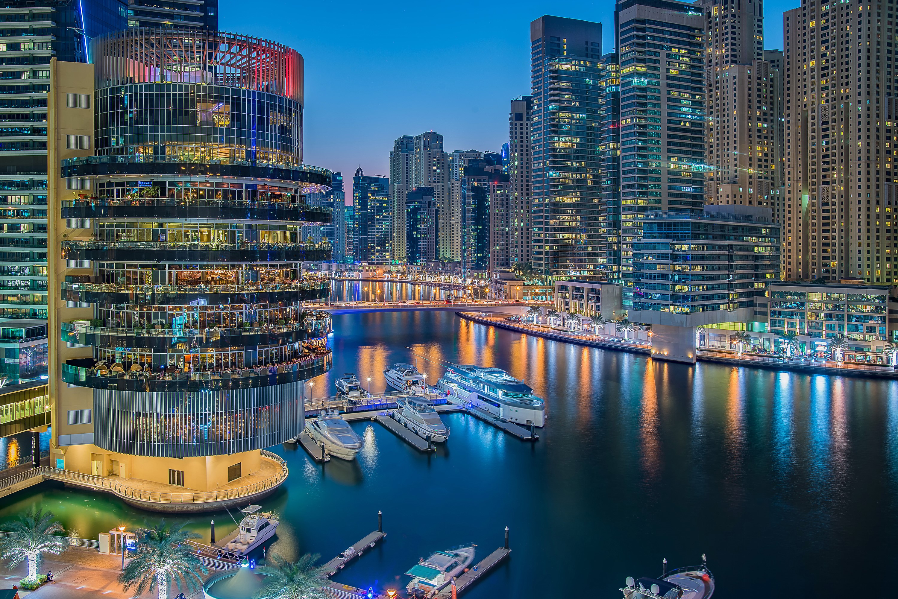 Dubai Marina at dusk with skyscrapers and yachts HD Wallpaper
