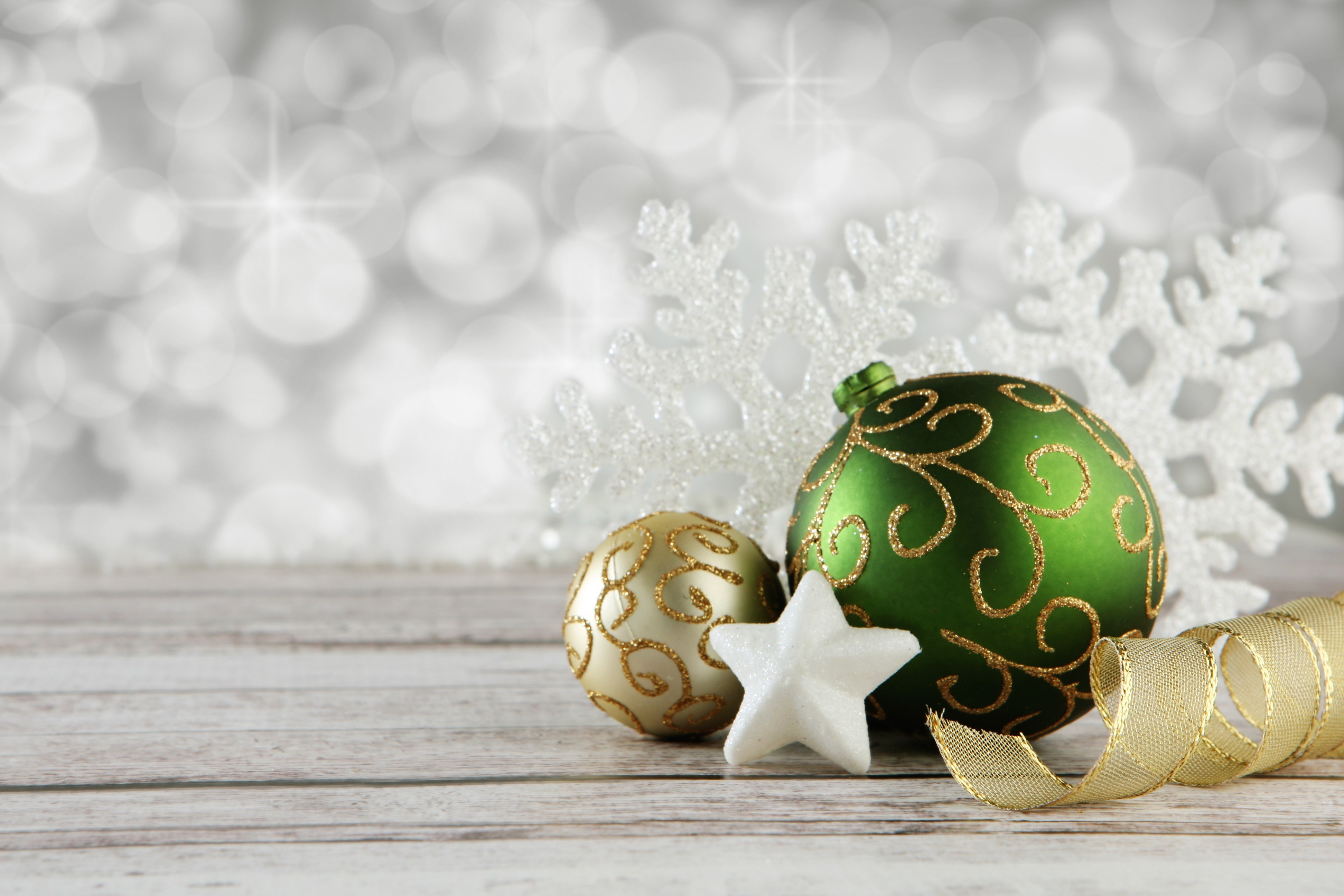 Christmas ornaments and snowflakes on wooden surface HD Wallpaper